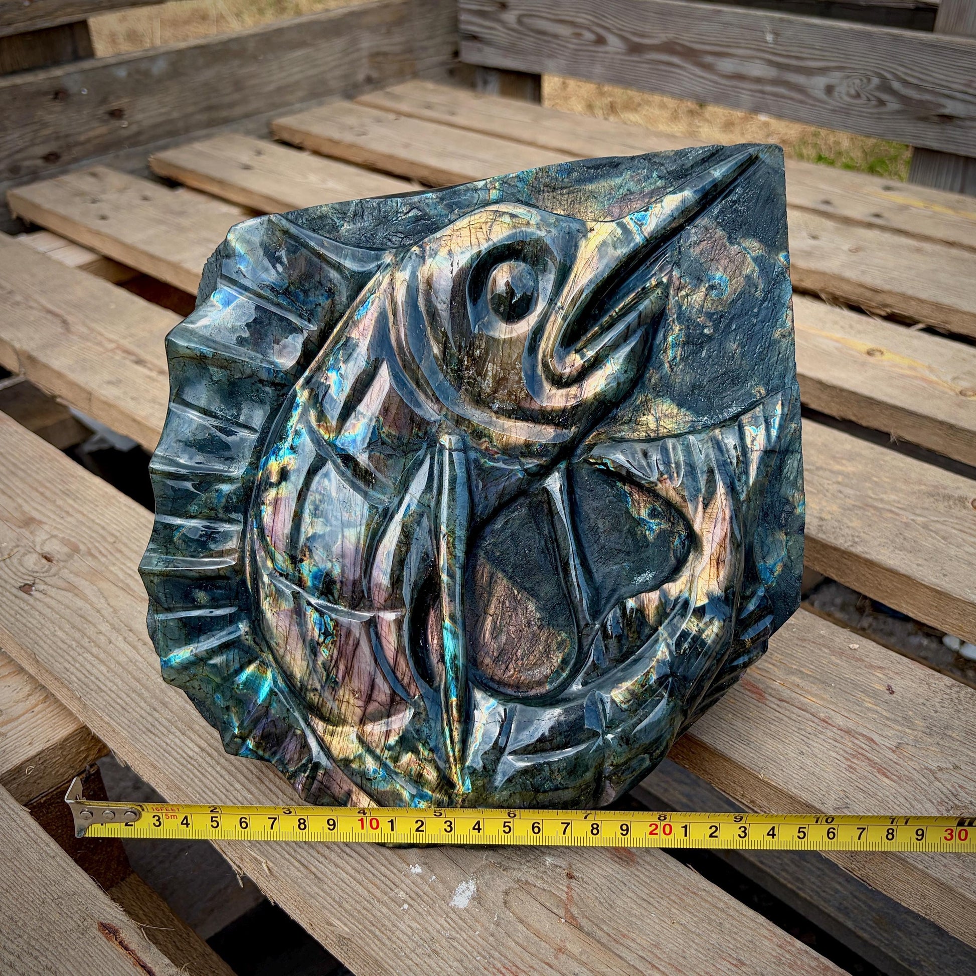 Handcrafted Madagascan Labradorite fish carved into a natural freeform with vibrant labradorescence