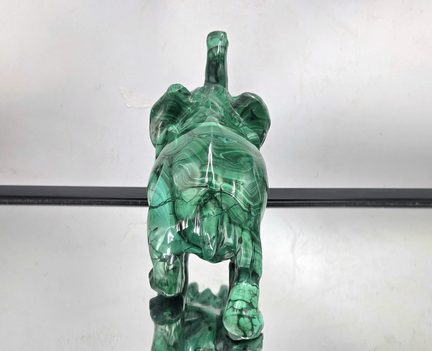Artisan-made malachite elephant stone carving handcrafted from genuine solid malachite crystal.