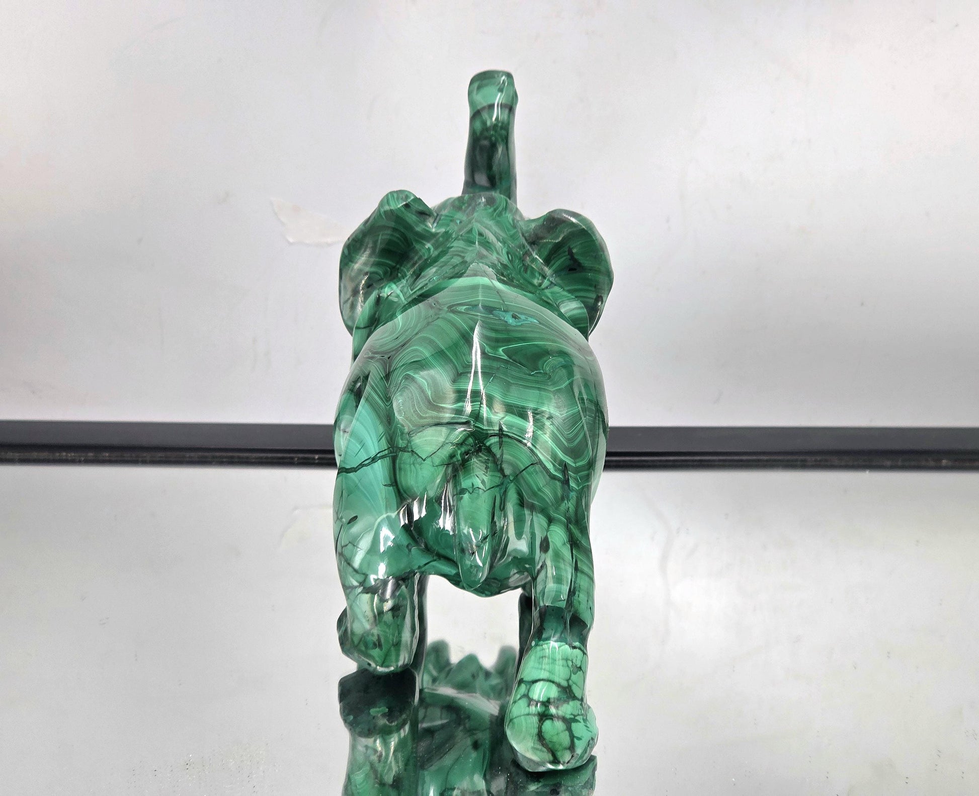 Artisan-made malachite elephant stone carving handcrafted from genuine solid malachite crystal.