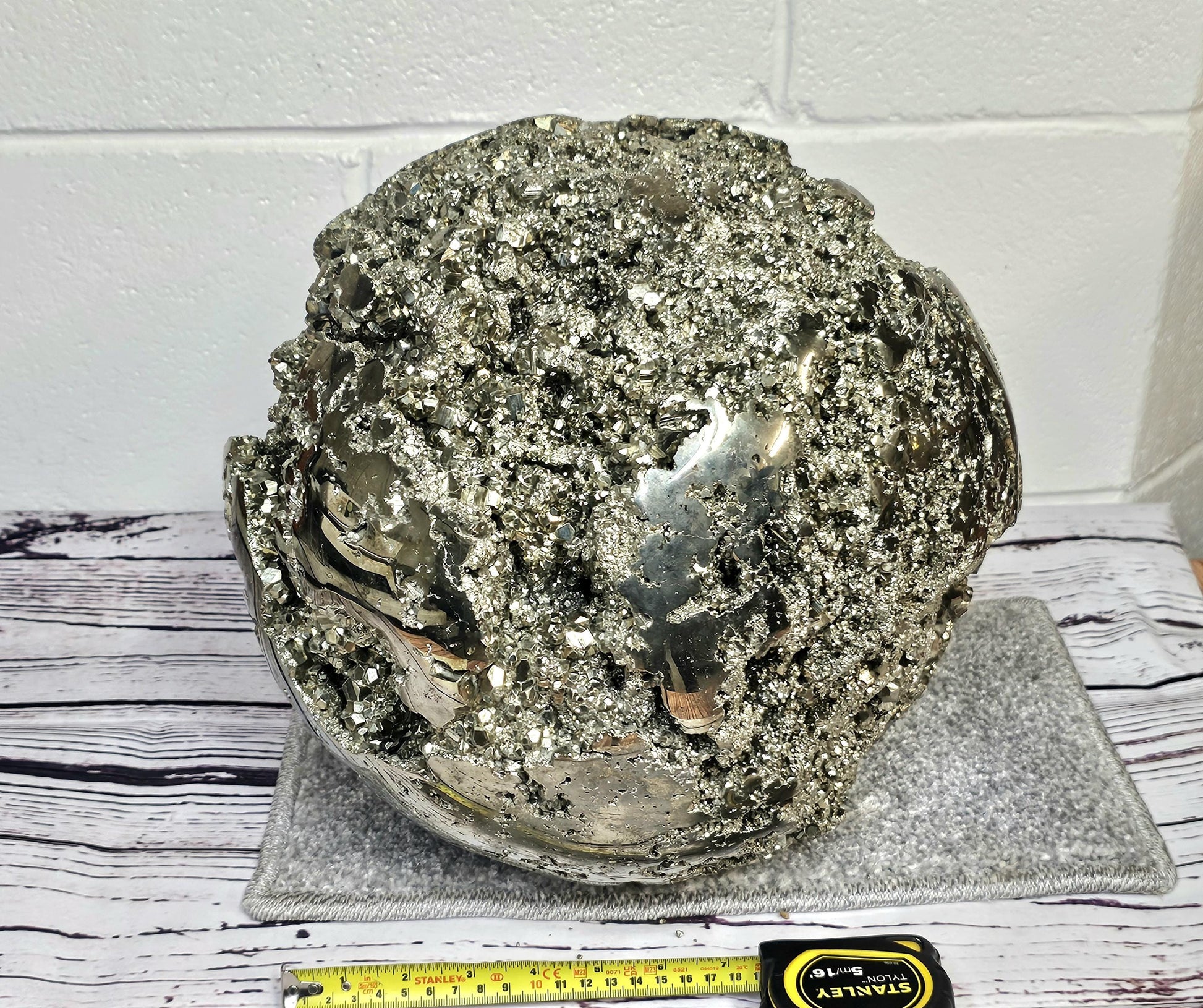 Metallic pyrite sphere for luxurious interiors and collectors.