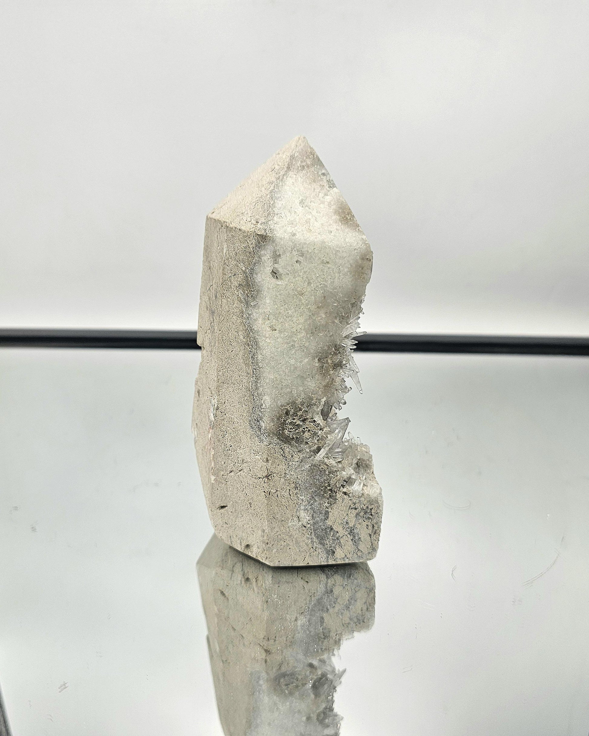 Celestite geode prism beautifully displayed, highlighting the sparkling needle crystals and delicate color.