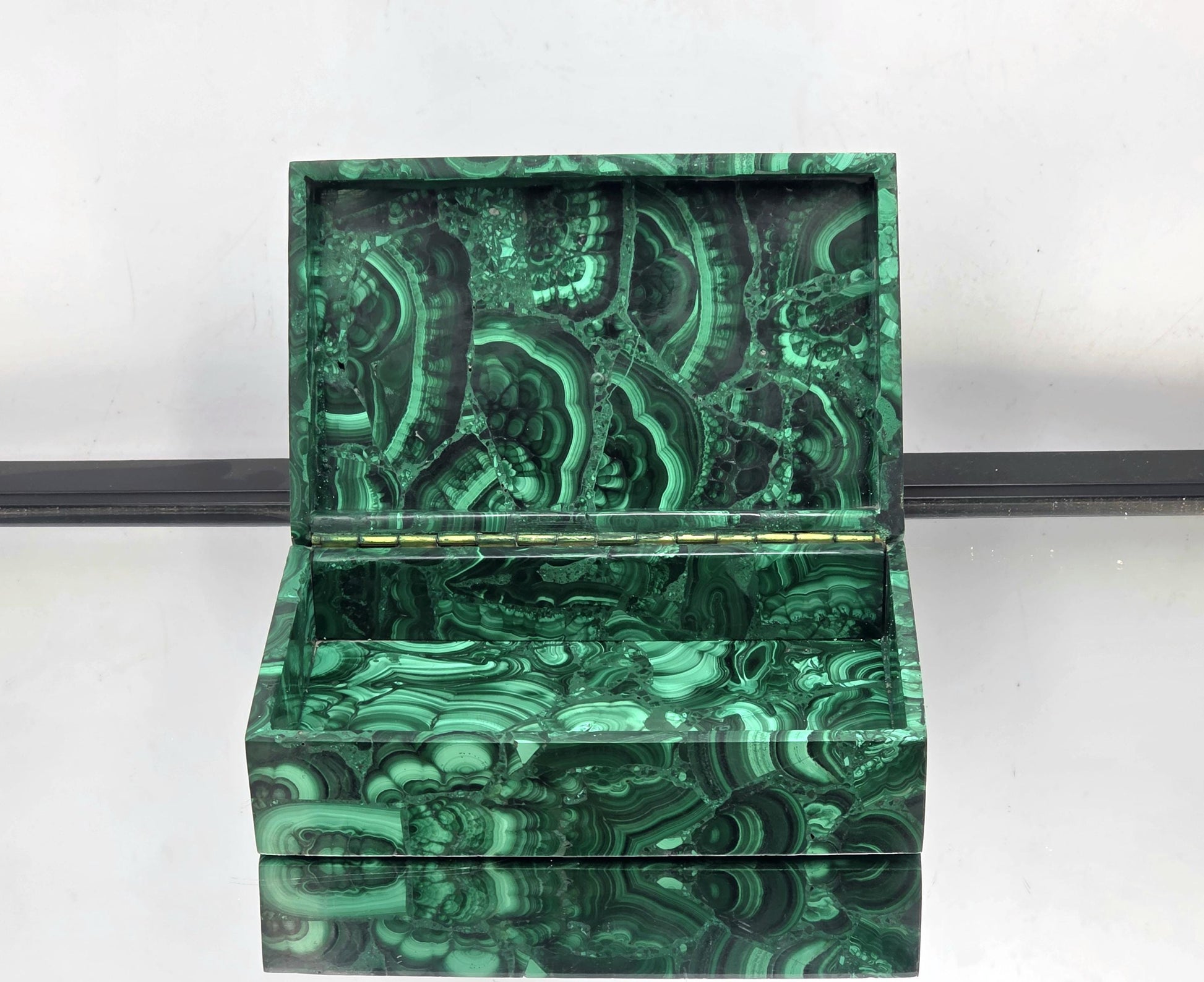 A home interior design piece featuring Malachite storage.