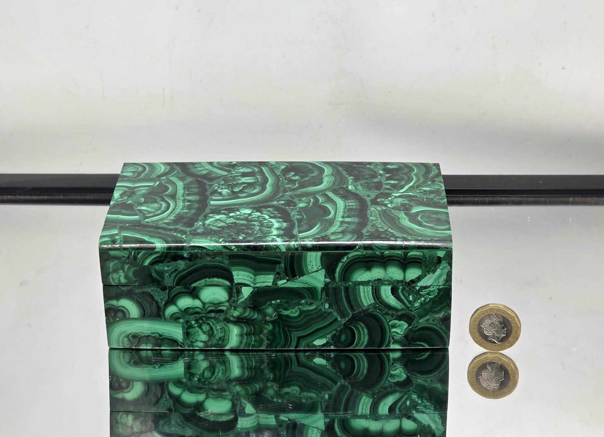 A jewellery storage box crafted from natural Malachite.