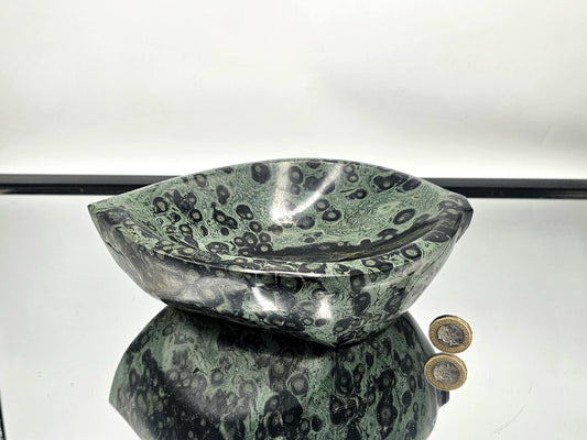 Hand-carved Kambaba Jasper leaf bowl with natural green patterns.