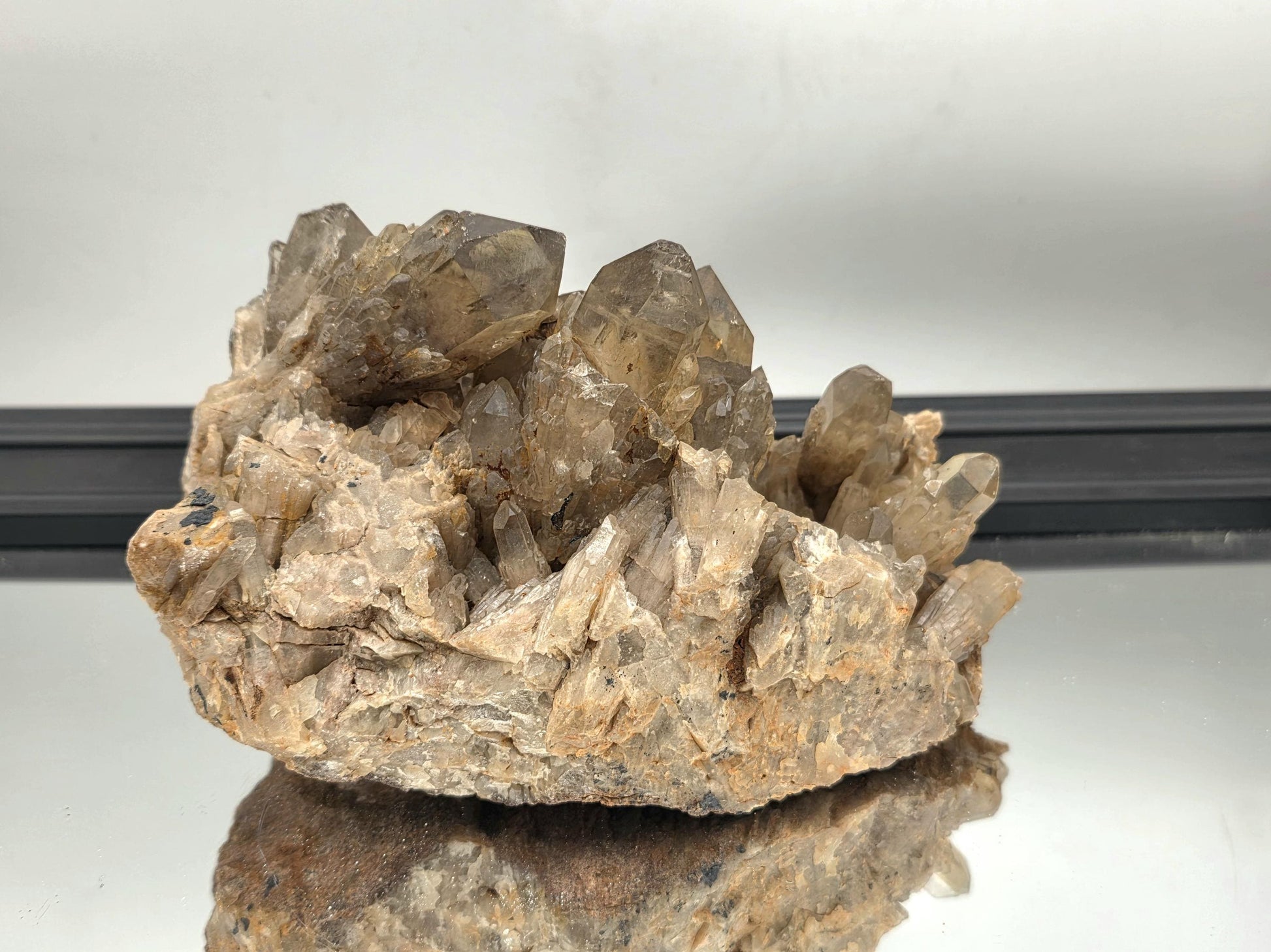 Large kundalini citrine cluster adding raw beauty and texture to a refined living space