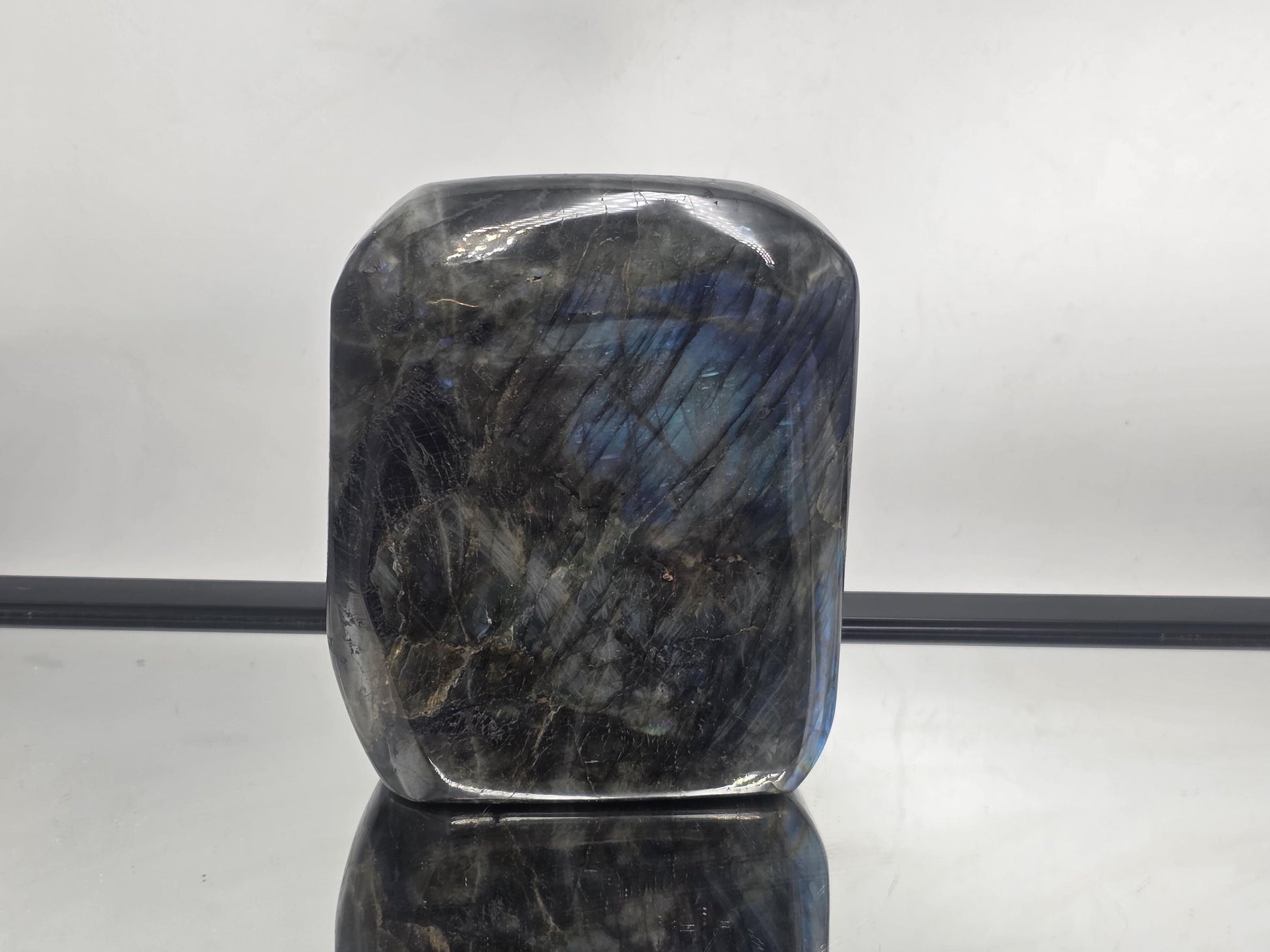 Labradorite Freeform crystal with polished finish and strong flash, highlighting its unique natural beauty.
