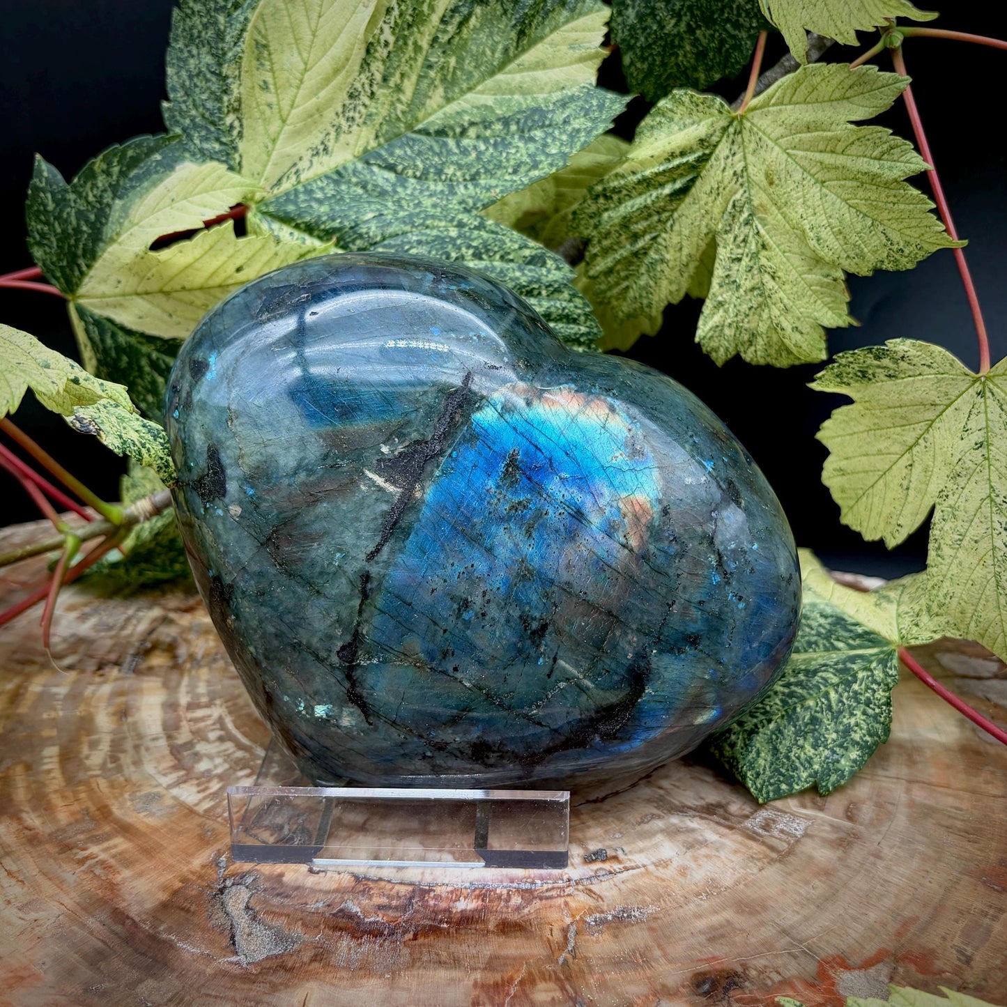 Hand carved Labradorite heart face crystal showing natural labradorescence