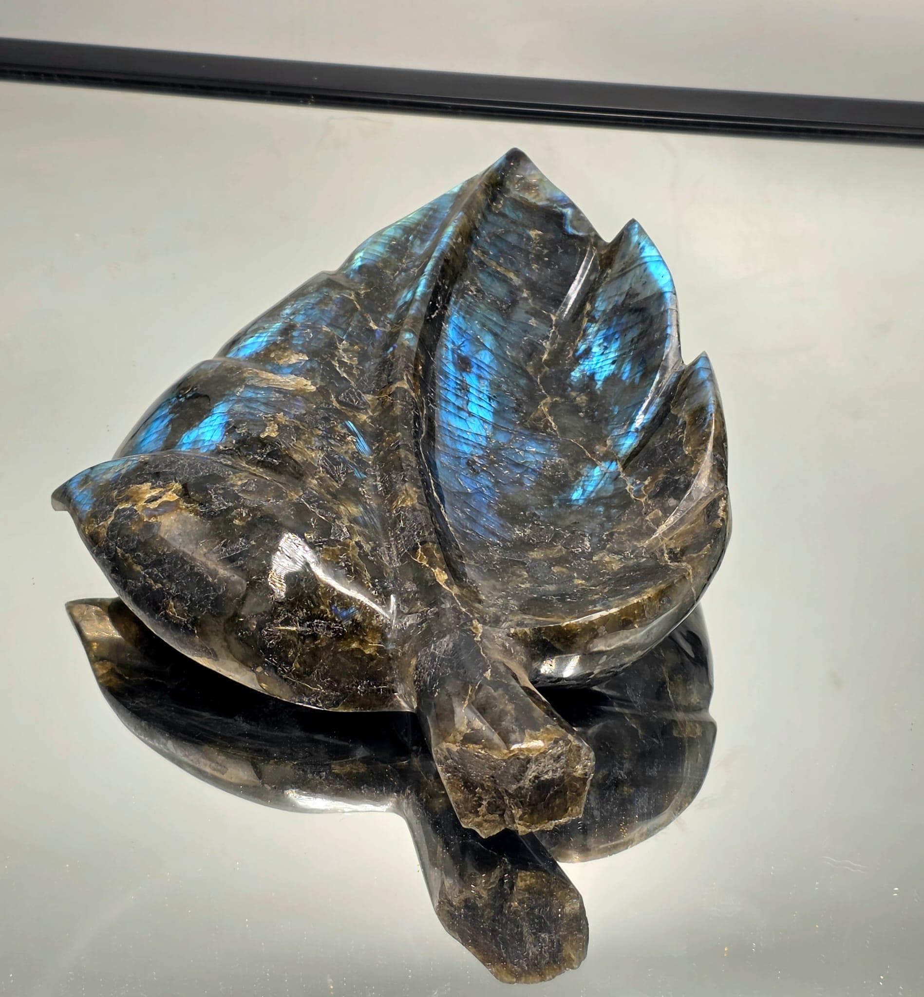 Hand-polished Labradorite leaf sculpture showcasing natural blue and green labradorescence — an elegant crystal décor gift for the festive season.