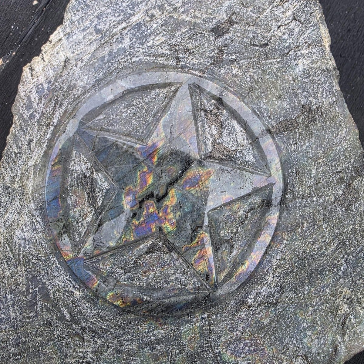 Natural Labradorite pentagram star carving for decorative home interiors.