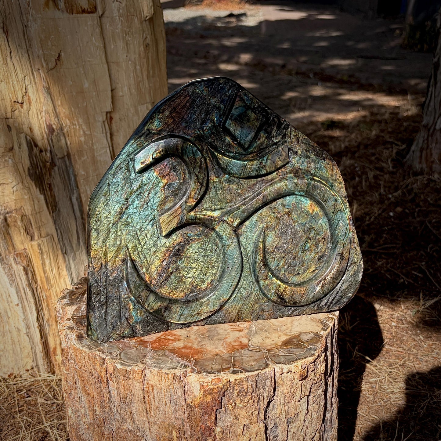 Detailed view of the Sacred Om carving showcasing expert Madagascan craftsmanship.