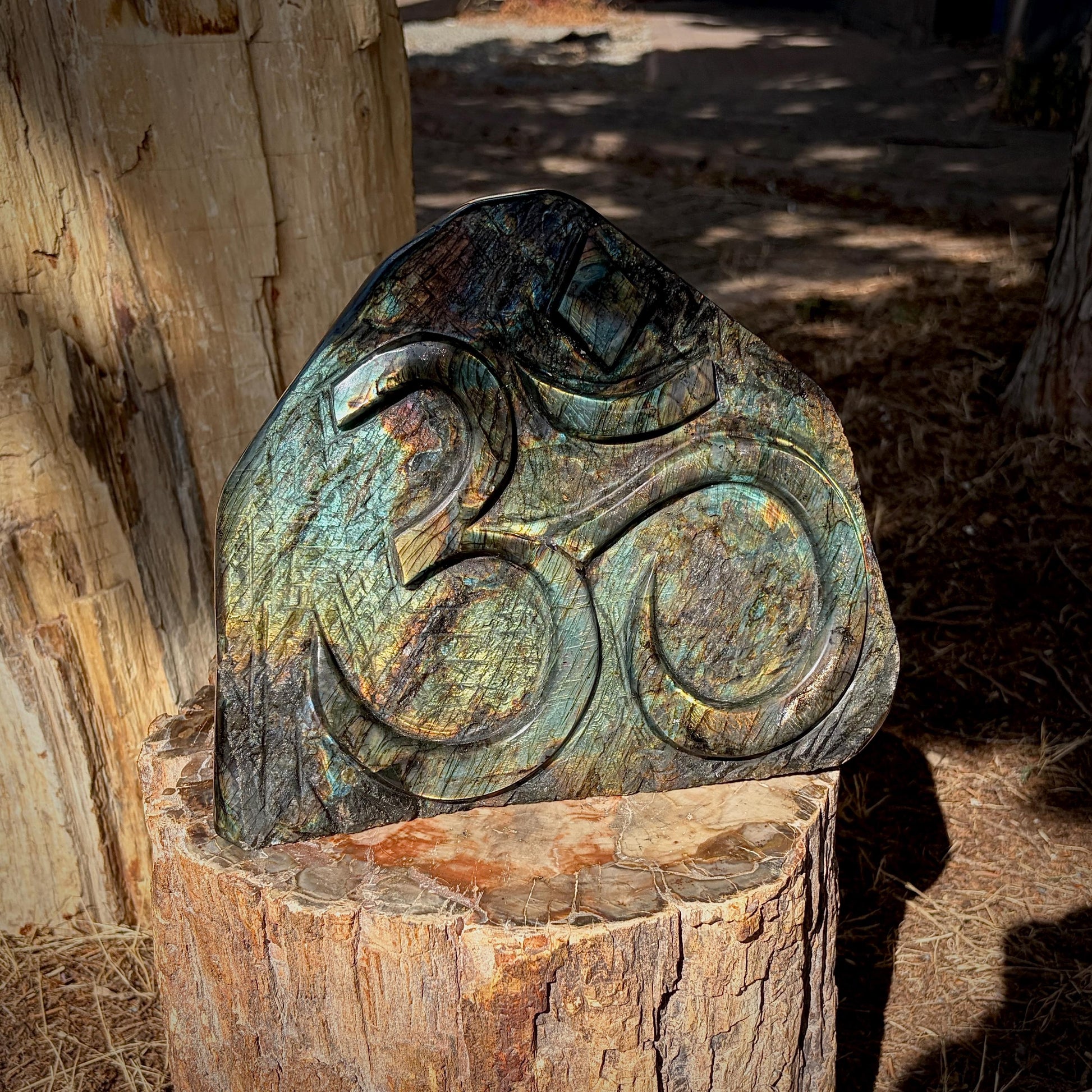 Detailed view of the Sacred Om carving showcasing expert Madagascan craftsmanship.