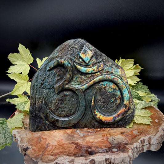 Front view of exceptional Madagascan Labradorite freeform featuring a hand-carved Sacred Om symbol.