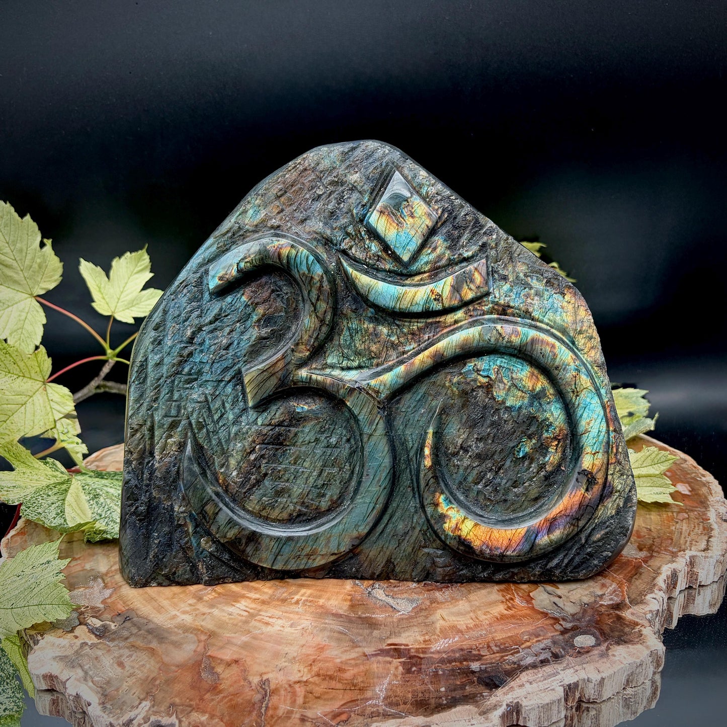 High-quality Labradorite Sacred Om sculpture with spectacular full-face flash.