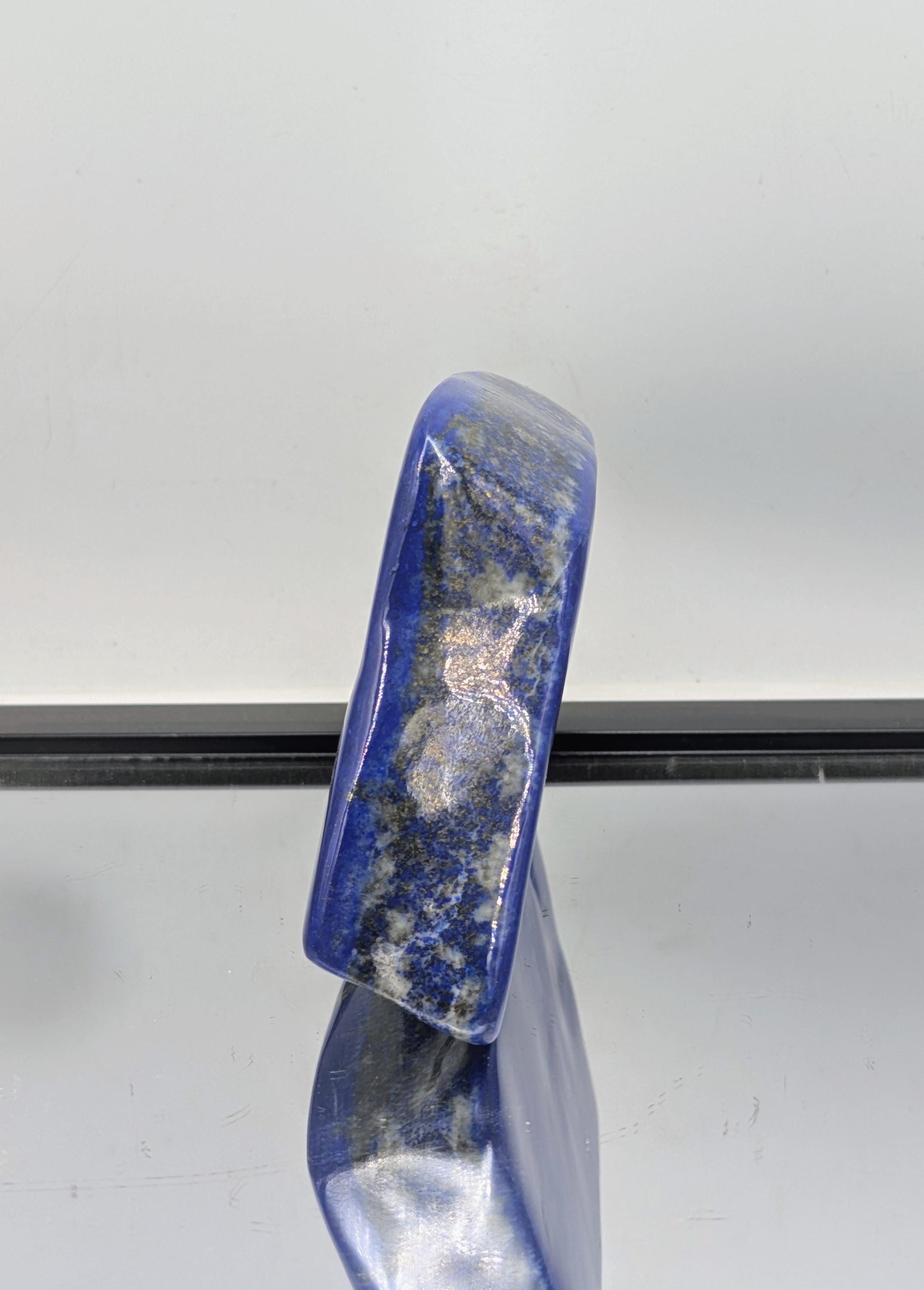  Natural Lapis Lazuli showcasing deep blue tones and pyrite shimmer.