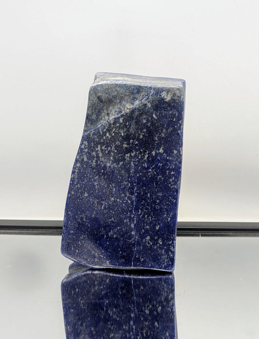 Polished Lapis Lazuli freeform crystal with deep blue and pyrite shimmer.