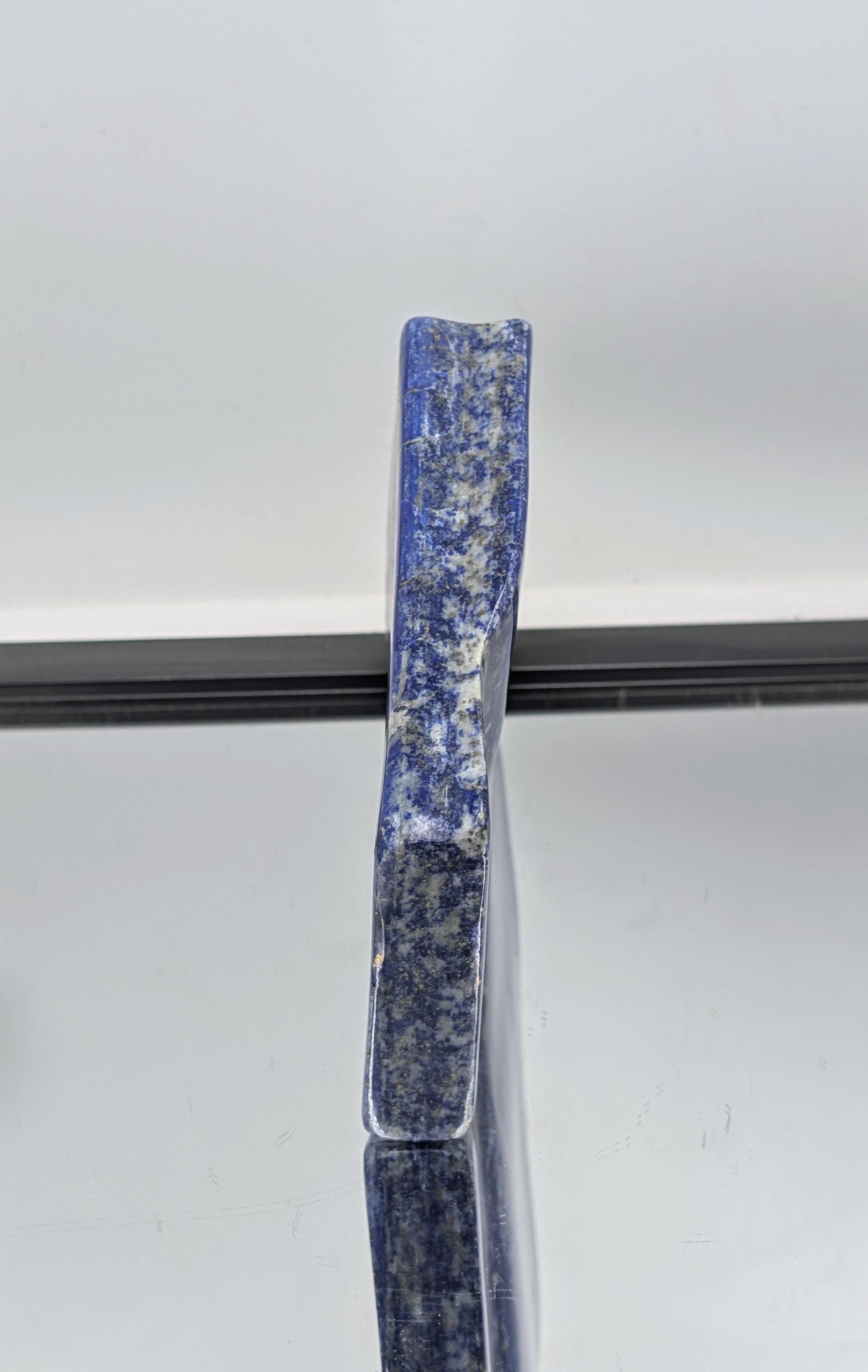 Decorative polished Lapis Lazuli freeform with royal blue tones.