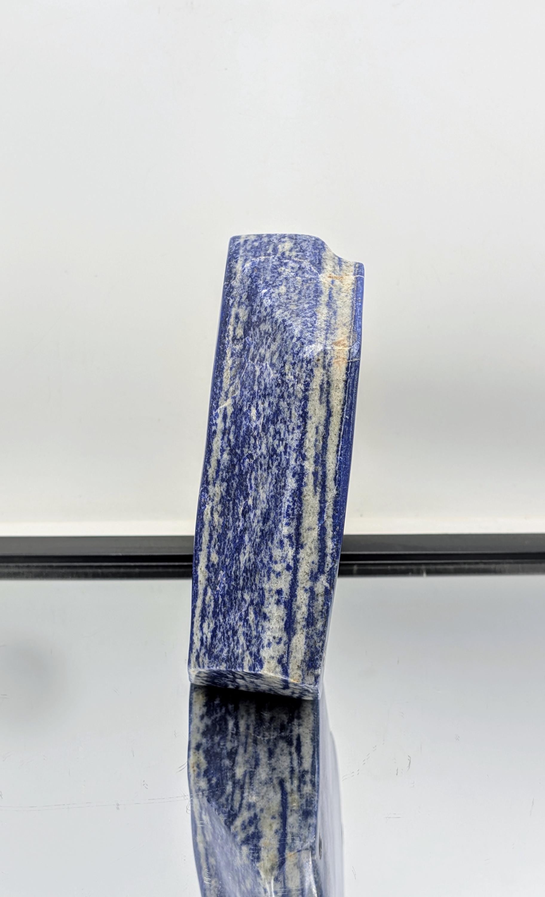 Natural stone polished Lapis Lazuli with freeform curves.