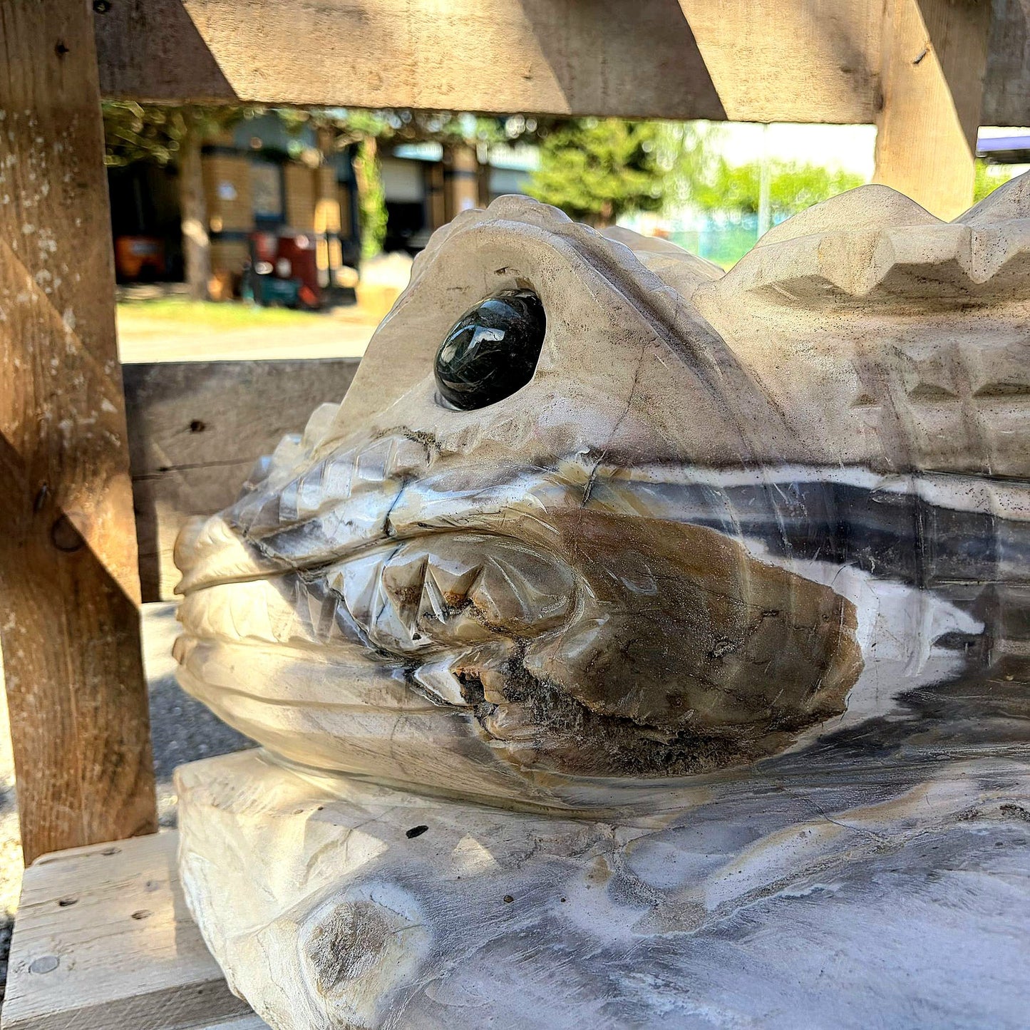 side profile of large agate crocodile sculpture