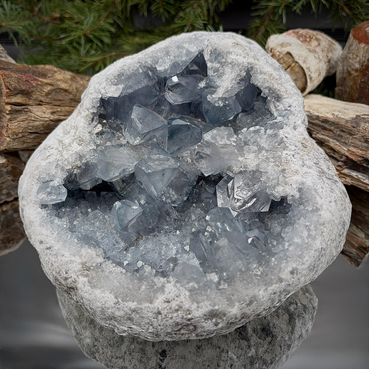 Alternative perspective of a Madagascan Celestite geode showing its natural crystalline formations and substantial shape.