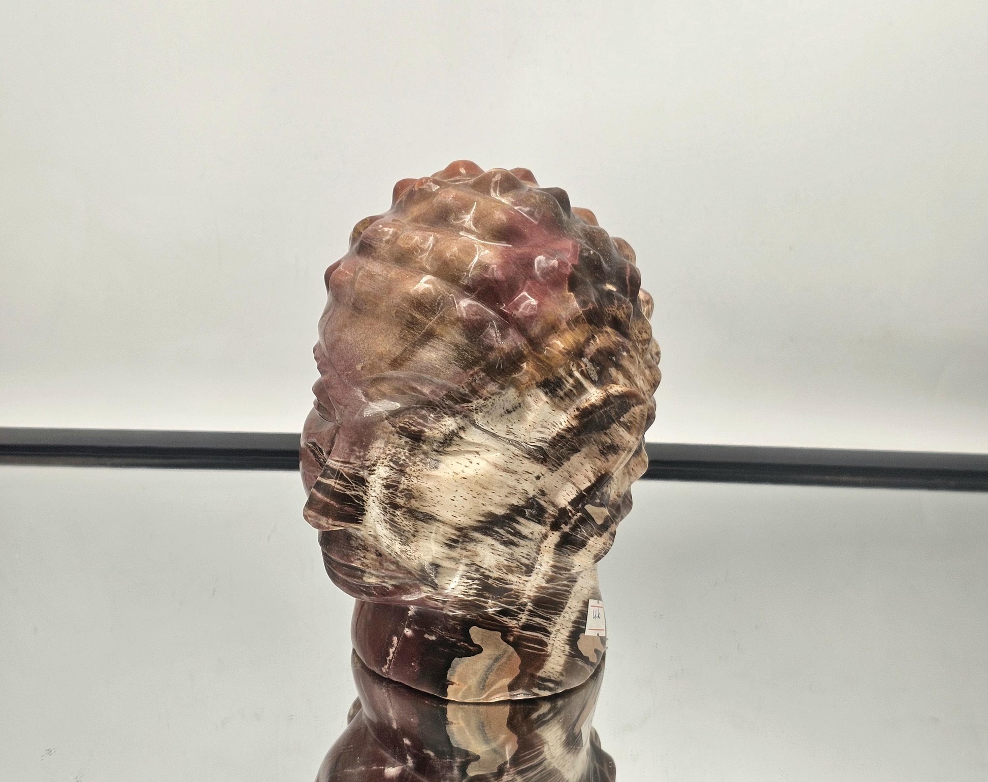 Large Buddha Crystal Carving made of Fossil Wood, showcasing Madagascar’s exceptional craftsmanship.