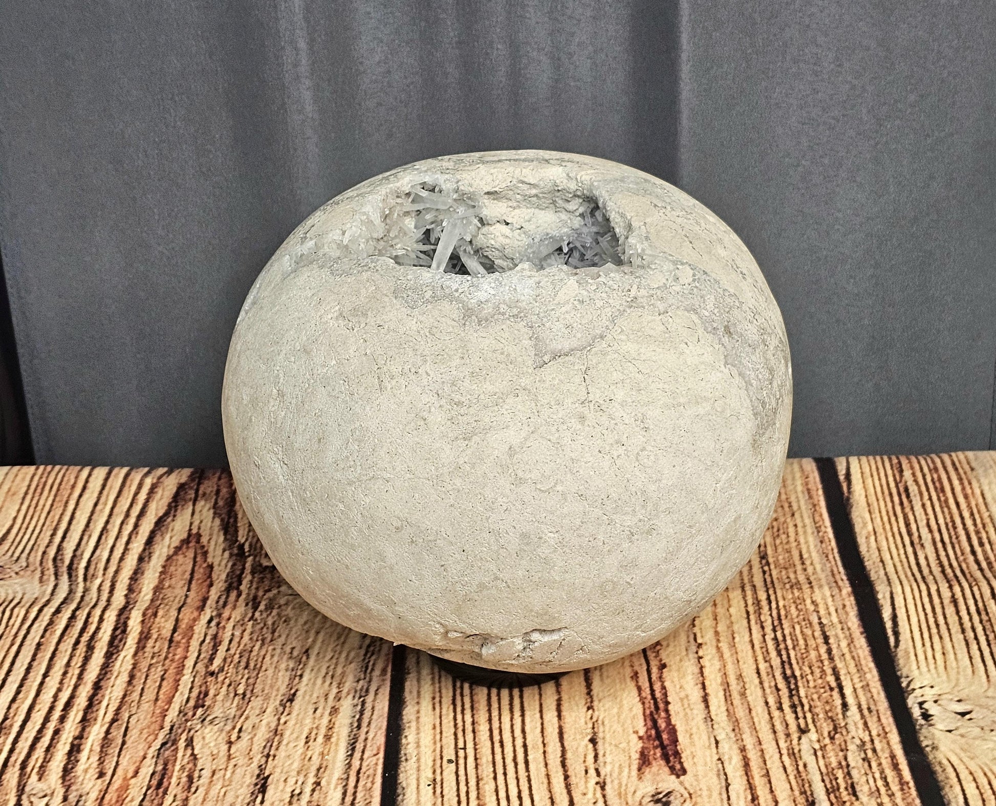 Large Celestite Geode Sphere sourced from Madagascar, showcasing its fine needle crystal formations.