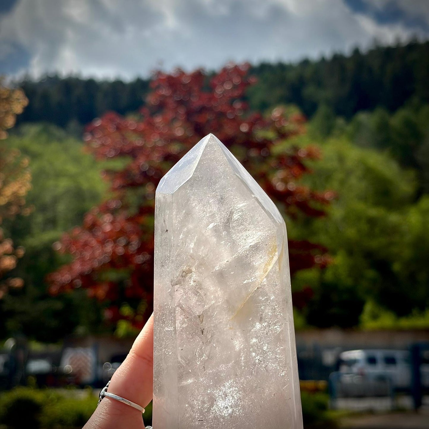 Large clear quartz sideboard decor piece with polished tower shape and natural mineral character.