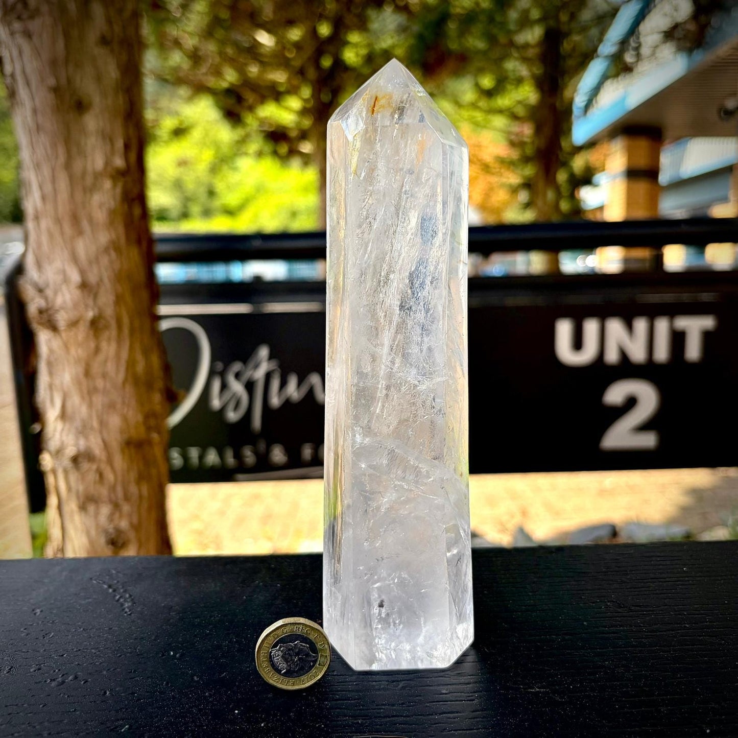 Large clear quartz statement piece with polished prism shape for elegant interior styling.