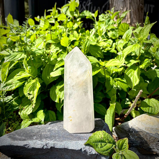 Large clear quartz tower statement decor piece, polished to highlight natural character and sculptural form.