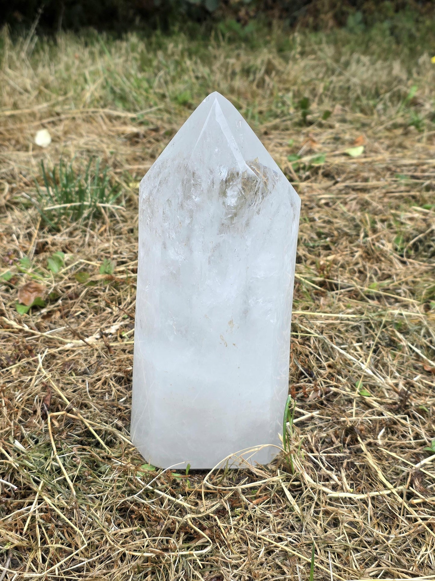 Large clear quartz tower with polished natural prism