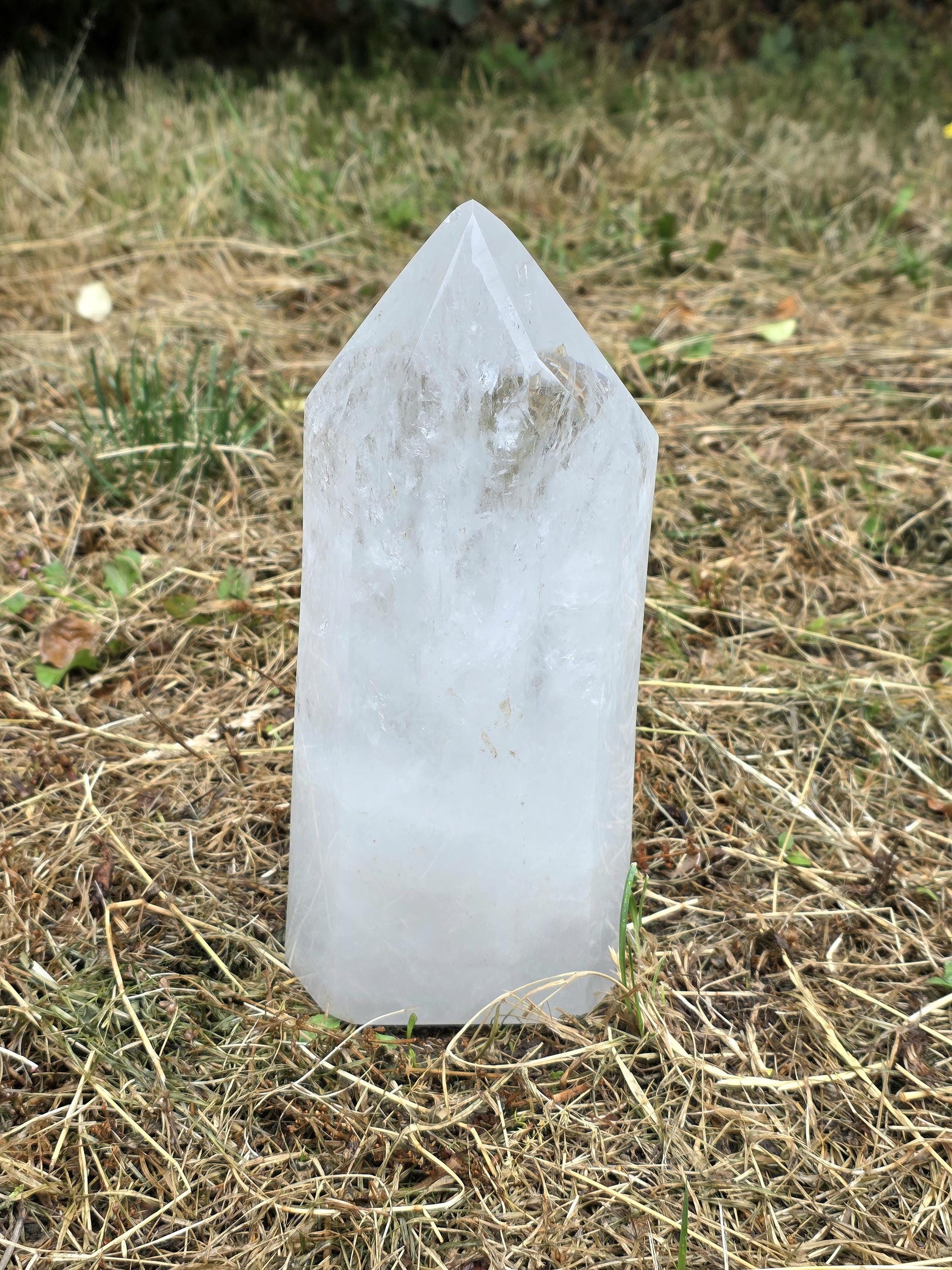 Large clear quartz tower with polished natural prism