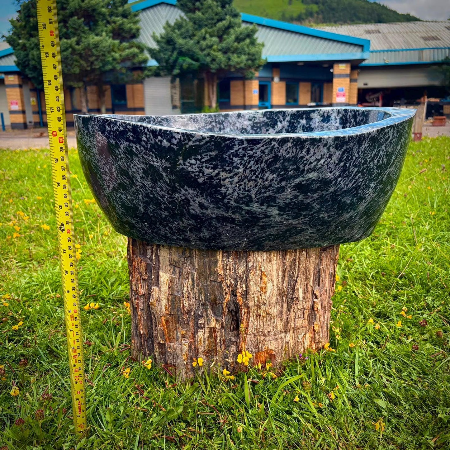 Large natural crystal bowl styled for a luxury interior display.