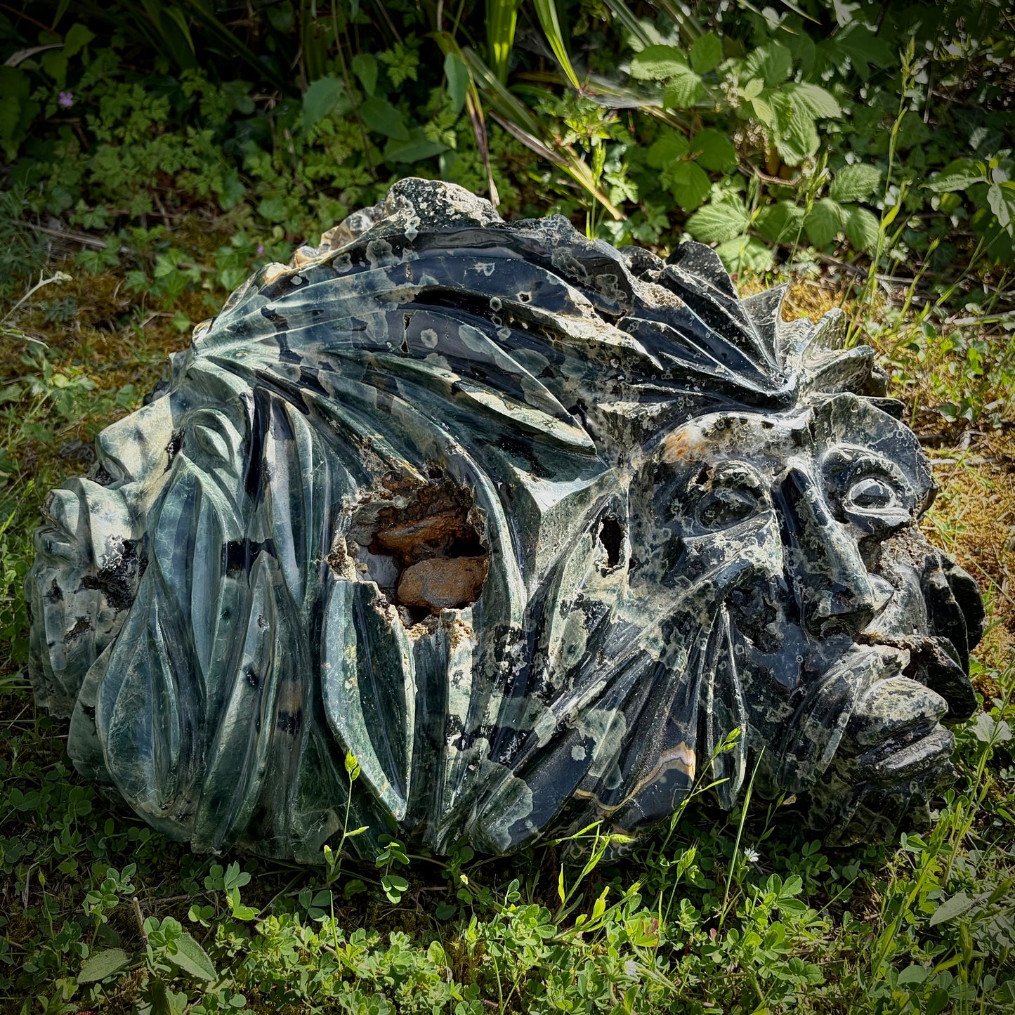 Large Green Man Ocean Jasper crystal carving with mystical faces and natural orbicular patterns