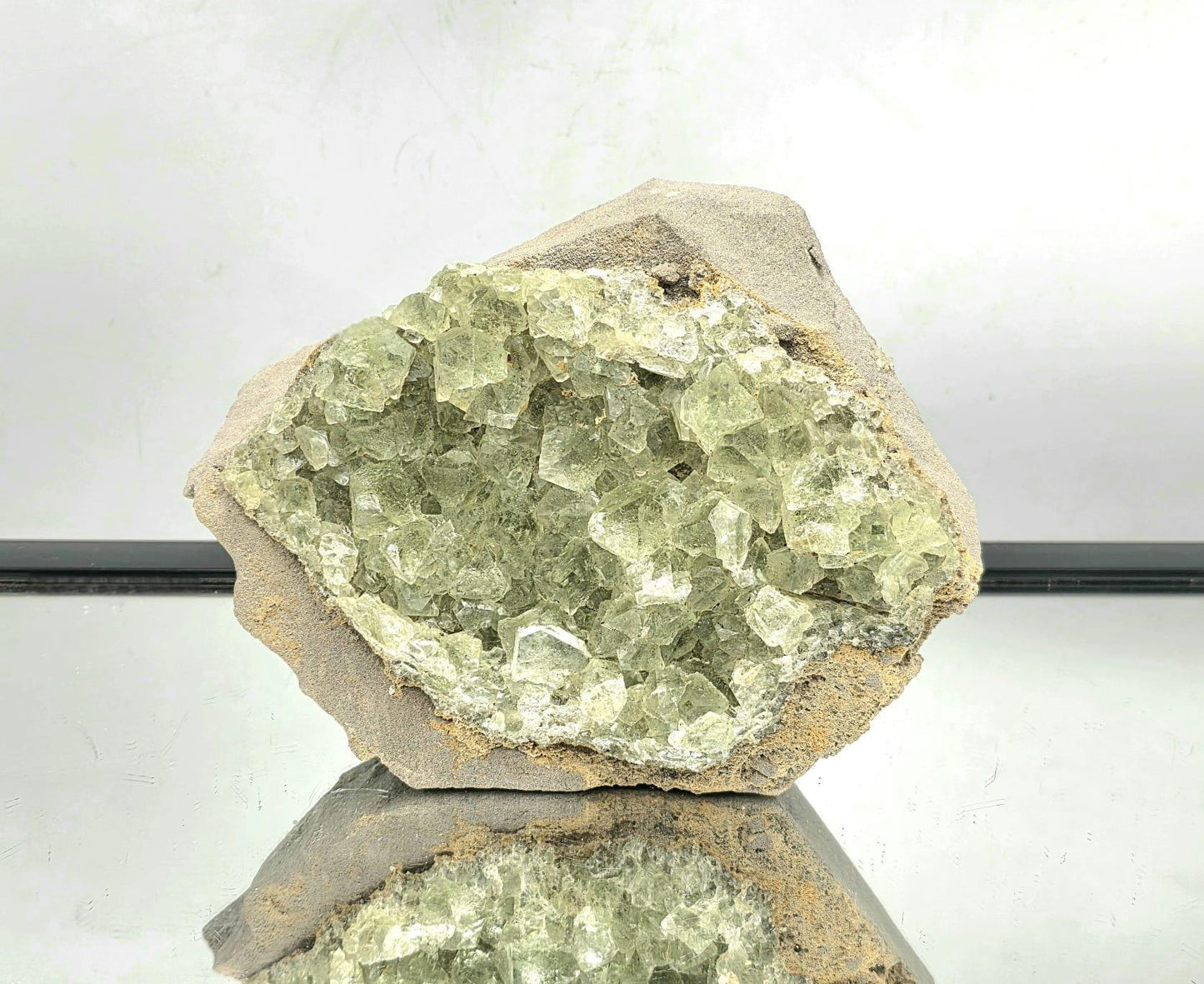 Large green octahedral fluorite crystal specimen from Imilchil, Morocco.