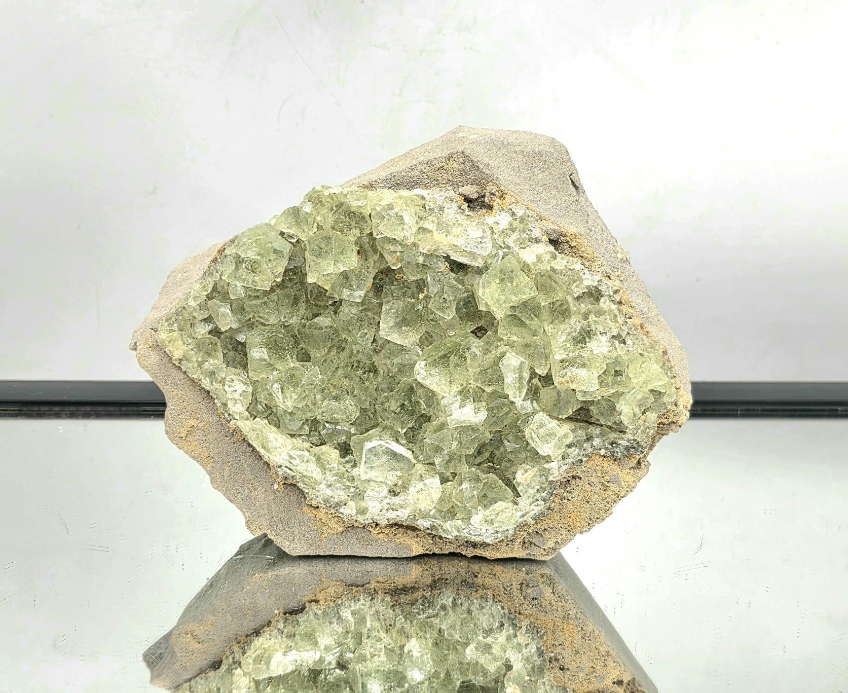 Large green octahedral fluorite crystal specimen from Imilchil, Morocco.