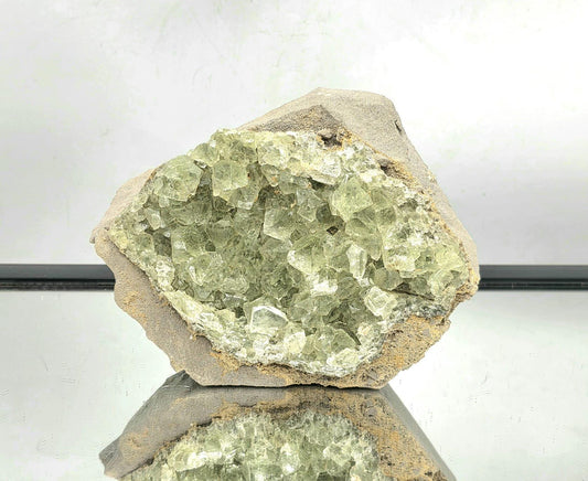 Large green octahedral fluorite crystal specimen from Imilchil, Morocco.
