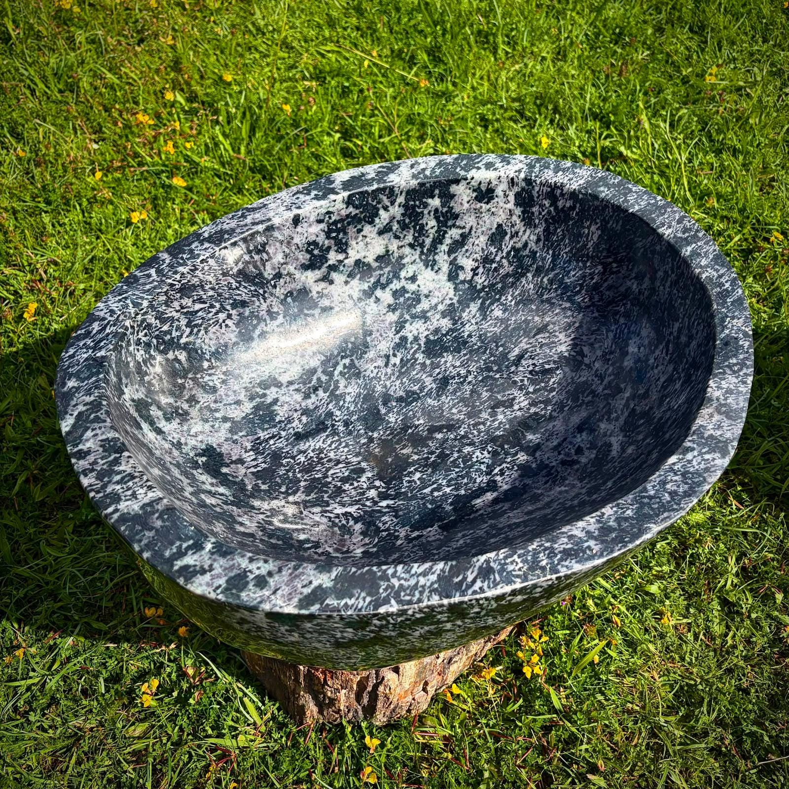 Large hand-carved crystal bowl designed as a luxury feature for refined home interiors.