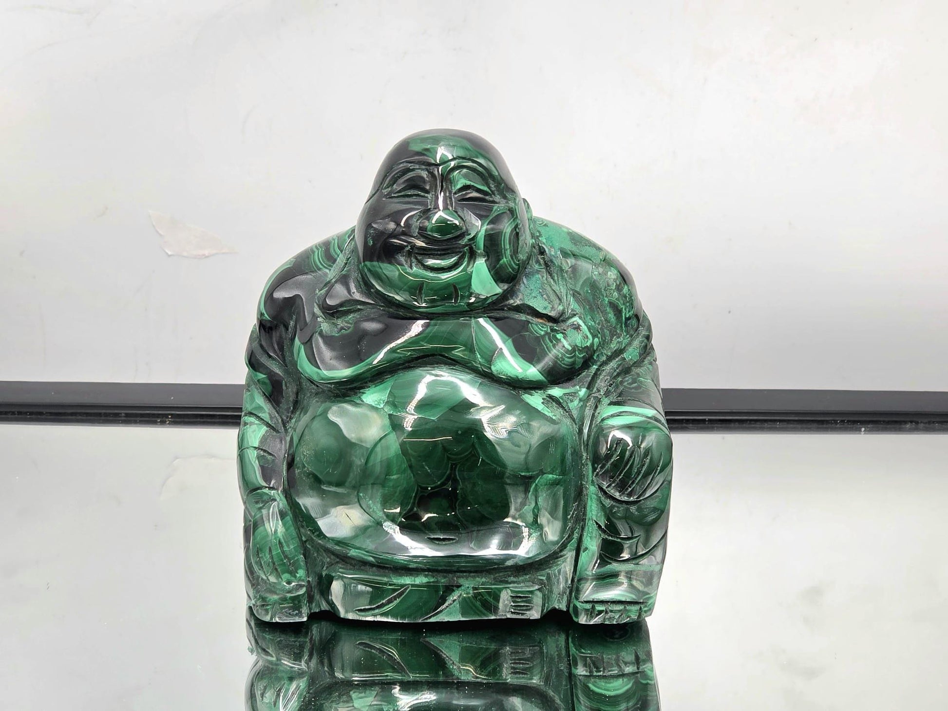 Large hand-carved Malachite Buddha statue with vivid green banding and polished surface — perfect for crystal collectors and serene home décor.