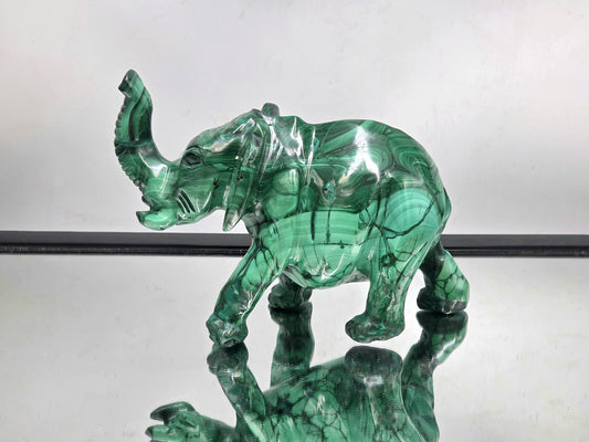 Large hand-carved malachite crystal elephant sculpture with natural green banding, polished finish, and intricate detailing.