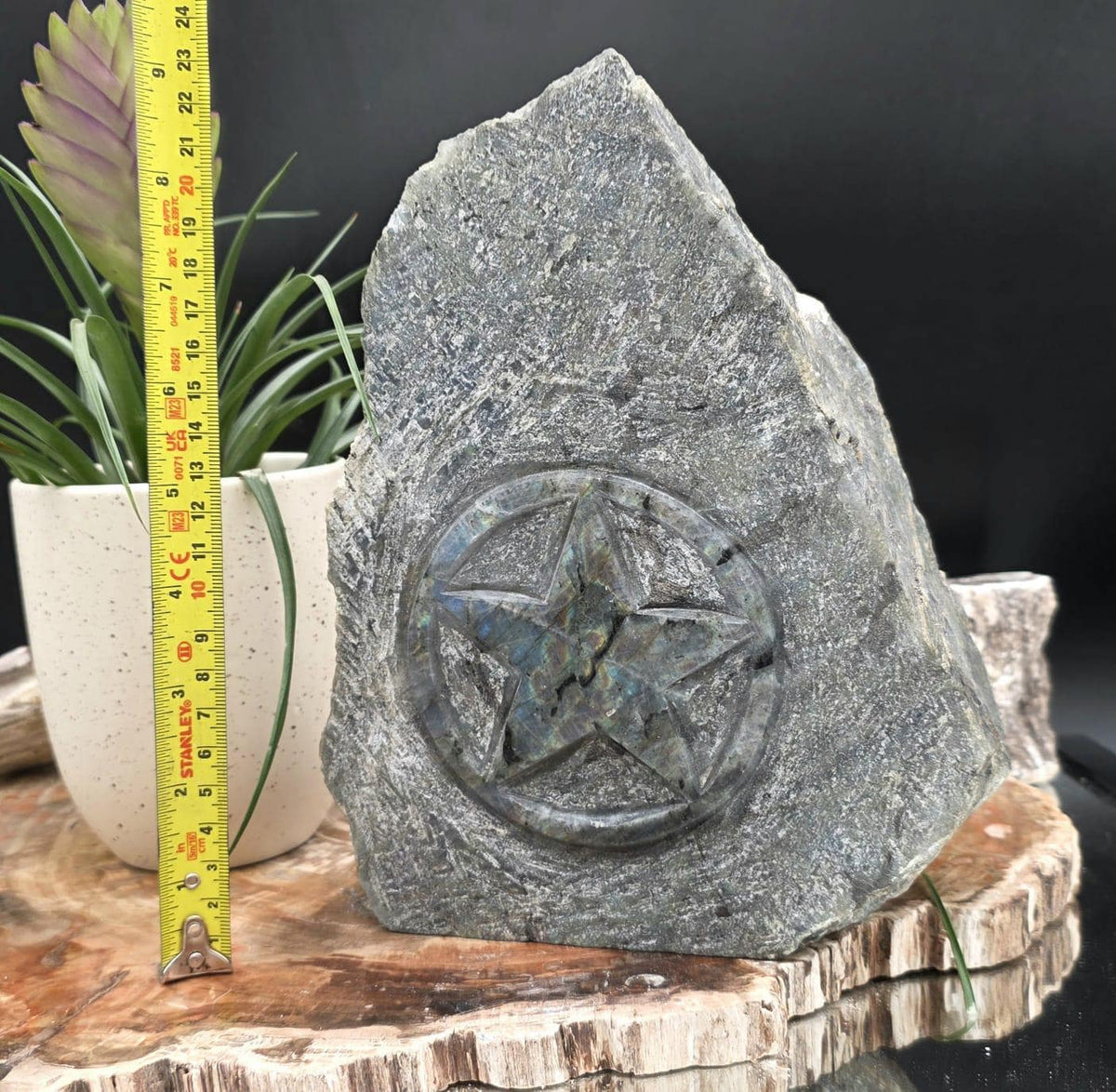 Large Labradorite pentagram carving for decorative crystal display.