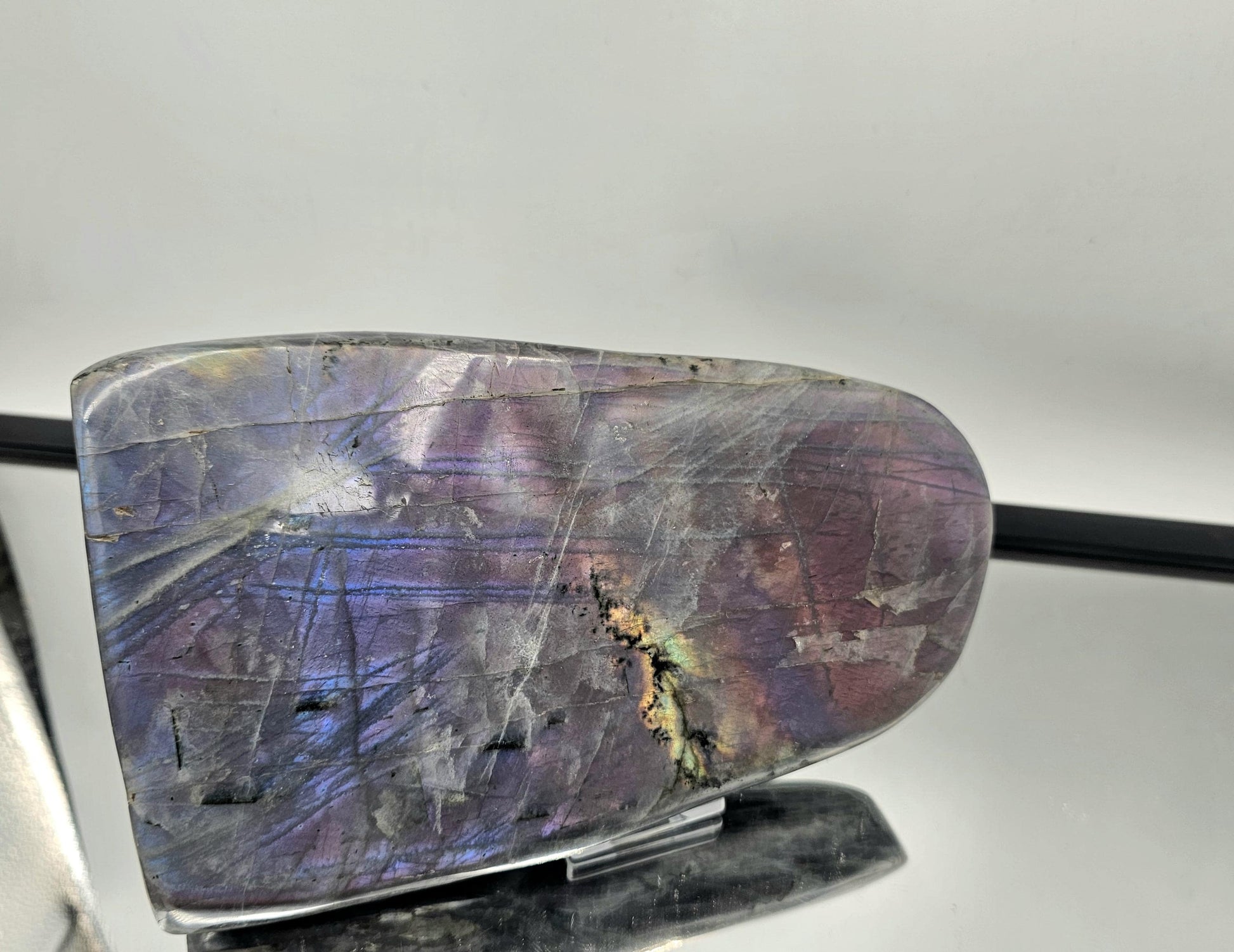 Large Purple Labradorite crystal showcasing vibrant flash.