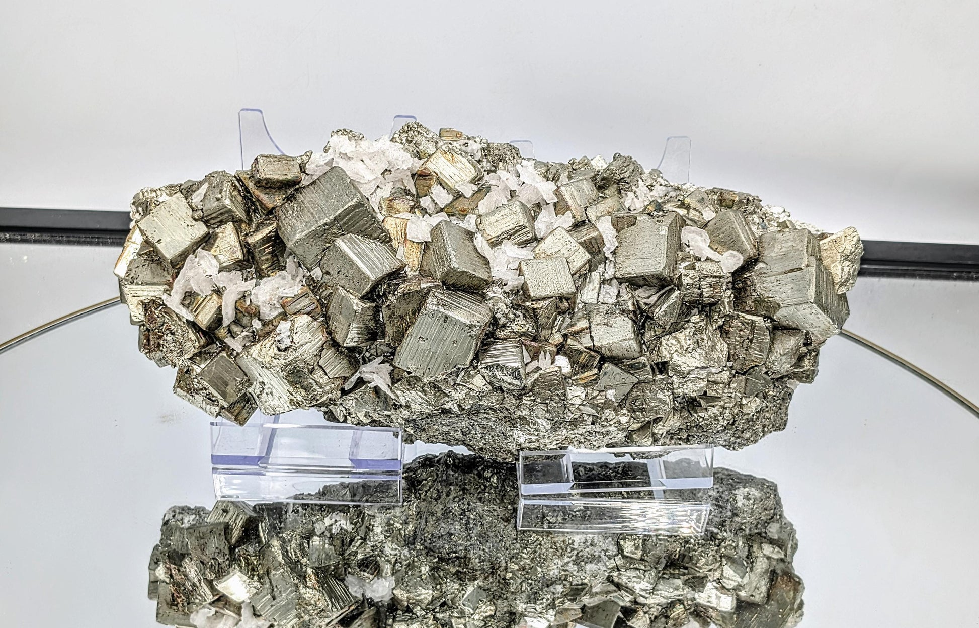 Large Pyrite crystal cluster with brilliant golden formations.
