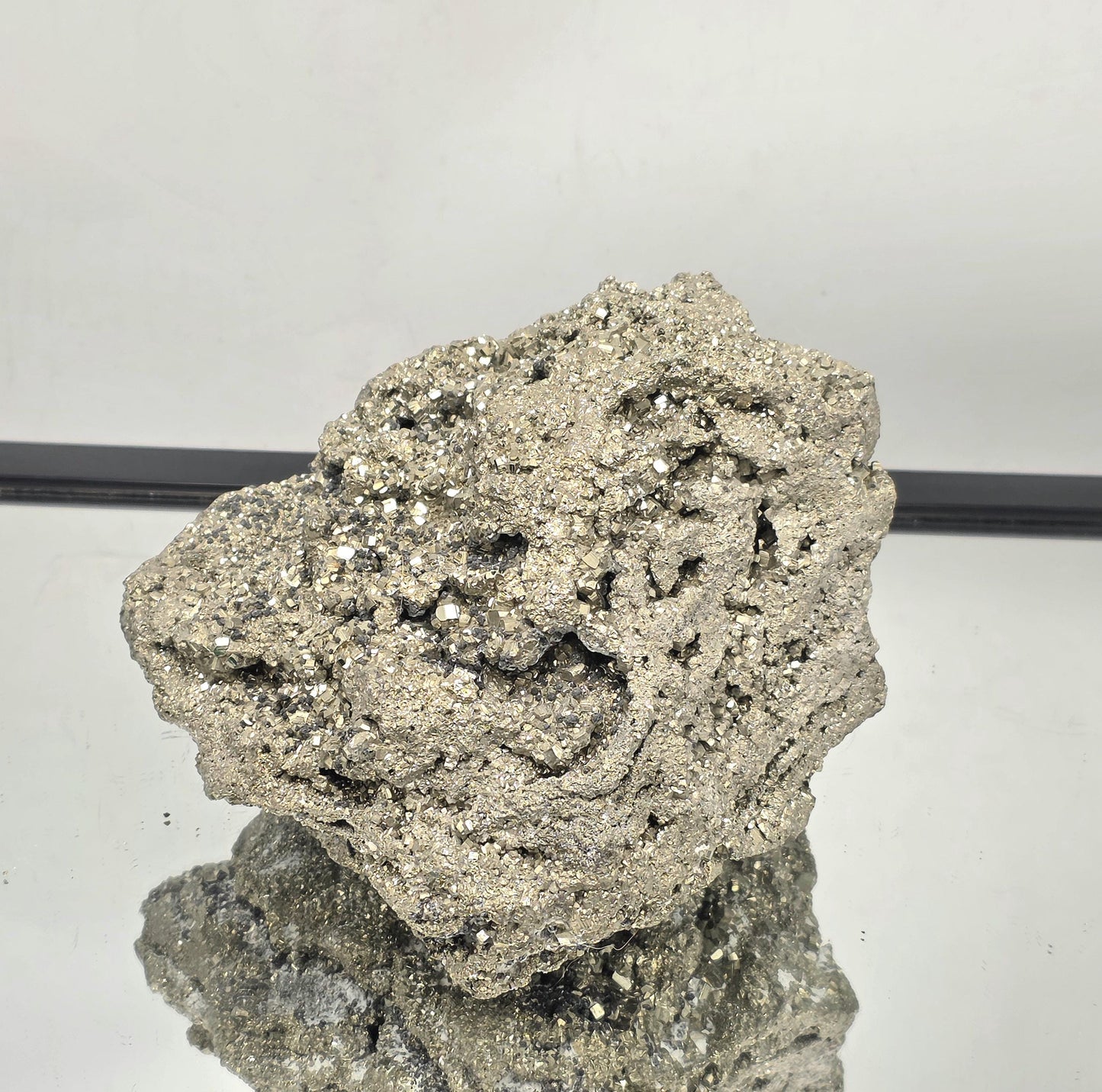 Large natural Pyrite cluster showing metallic golden cubes.