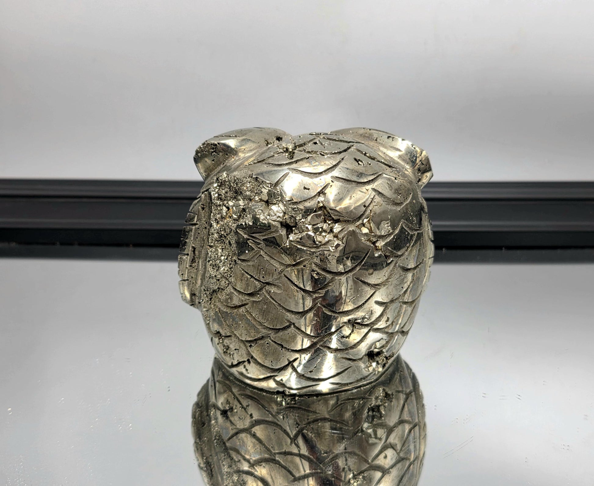 Shimmering crystal owl carved from natural pyrite