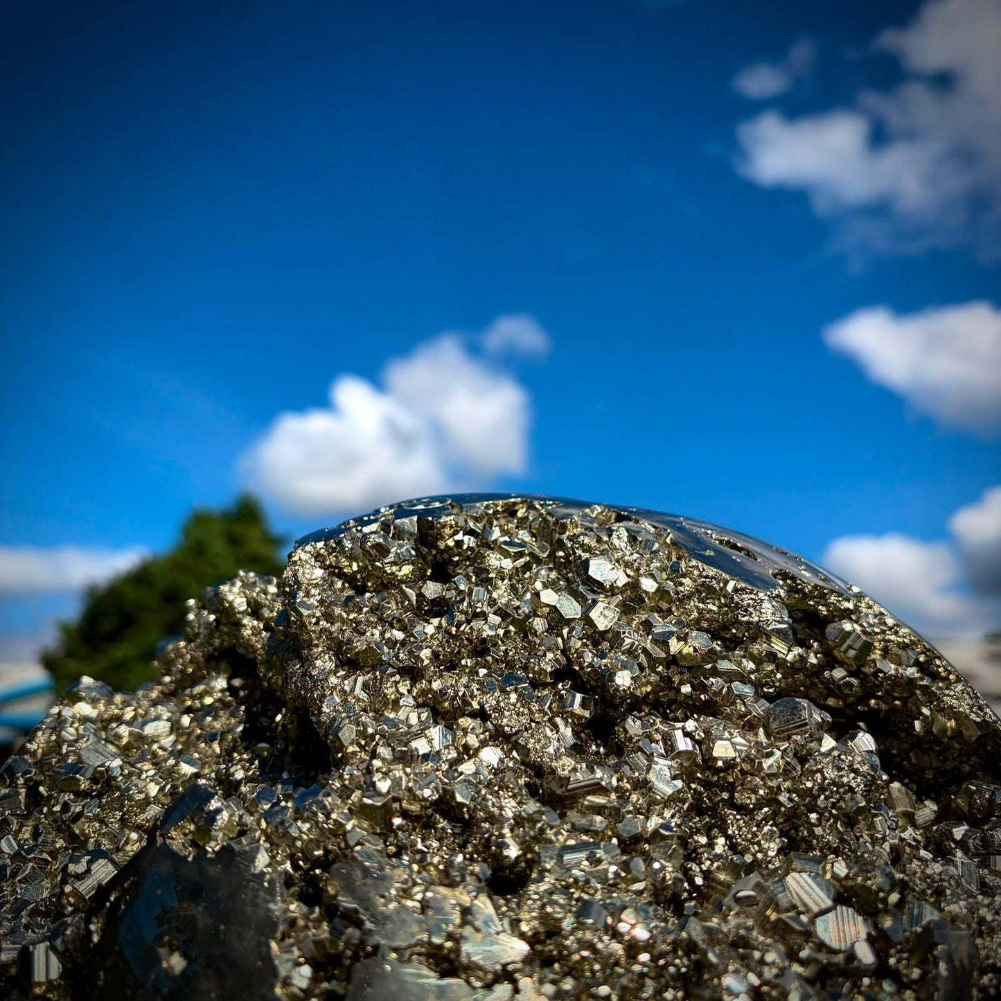 Large Peruvian Pyrite sphere presented as a sculptural natural stone feature.