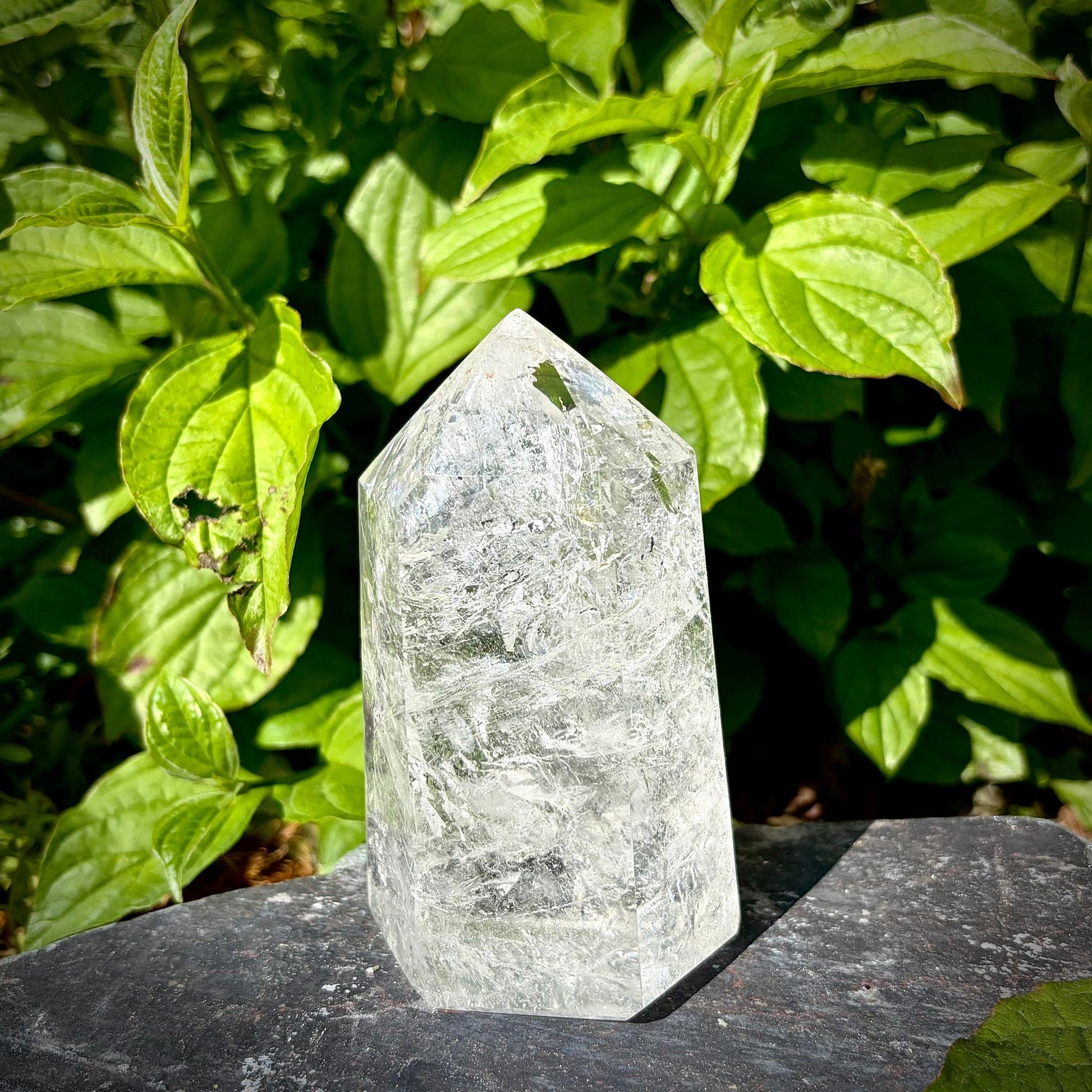 Large quartz crystal prism for home decor, hand selected for its polished finish and natural character.