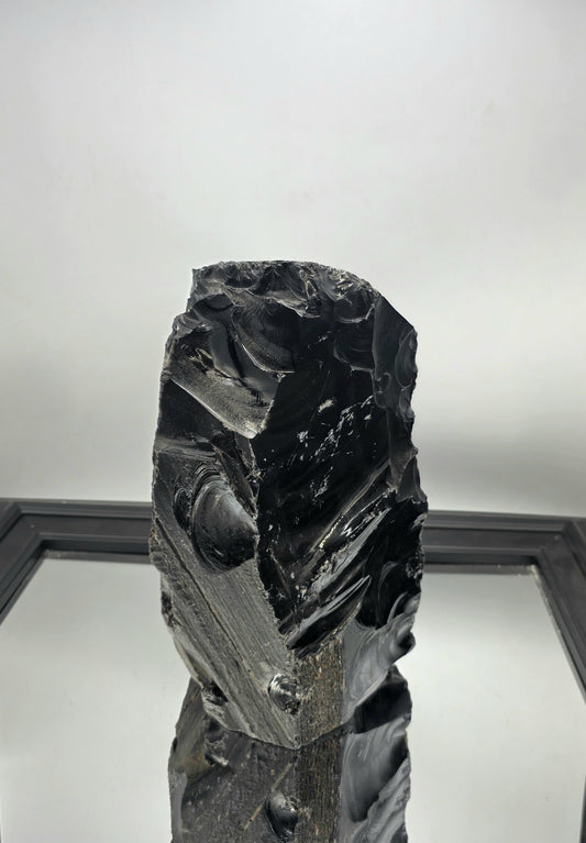 Large raw Obsidian crystal with rough texture, ideal for Wabi-Sabi interiors.