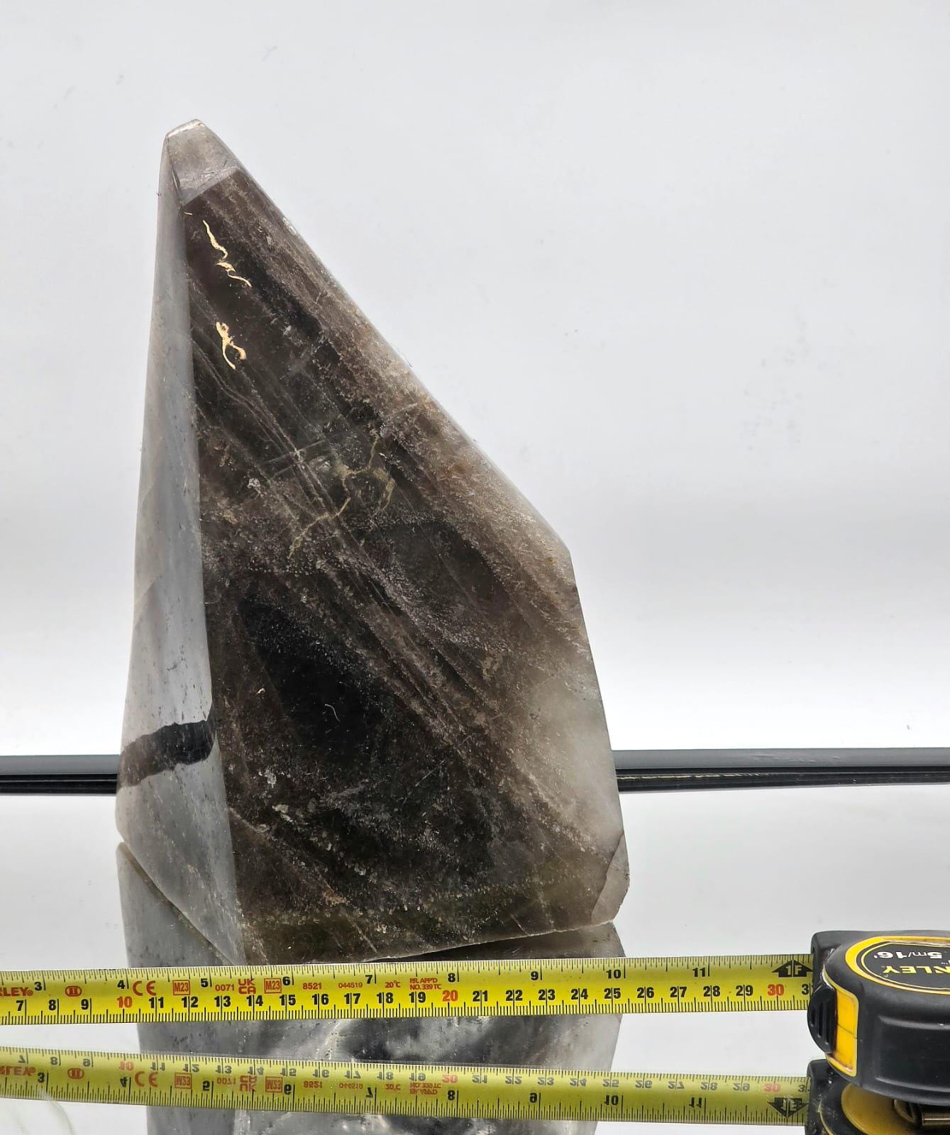 large smoky quartz crystal close up polished surface