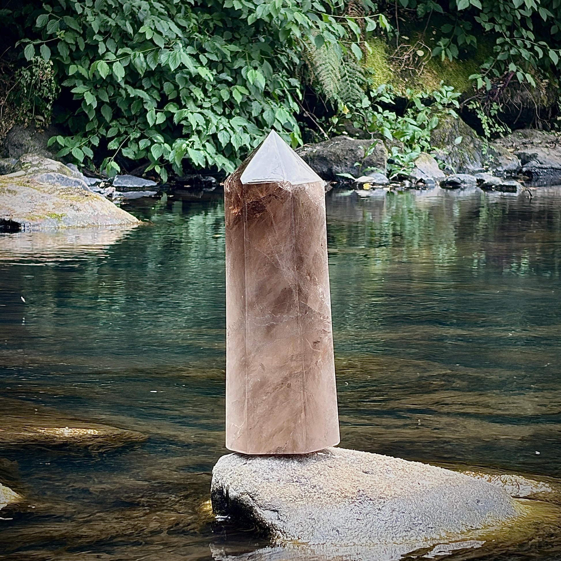 Rear view of the one-of-a-kind Smoky Quartz tower showcasing its natural structure.