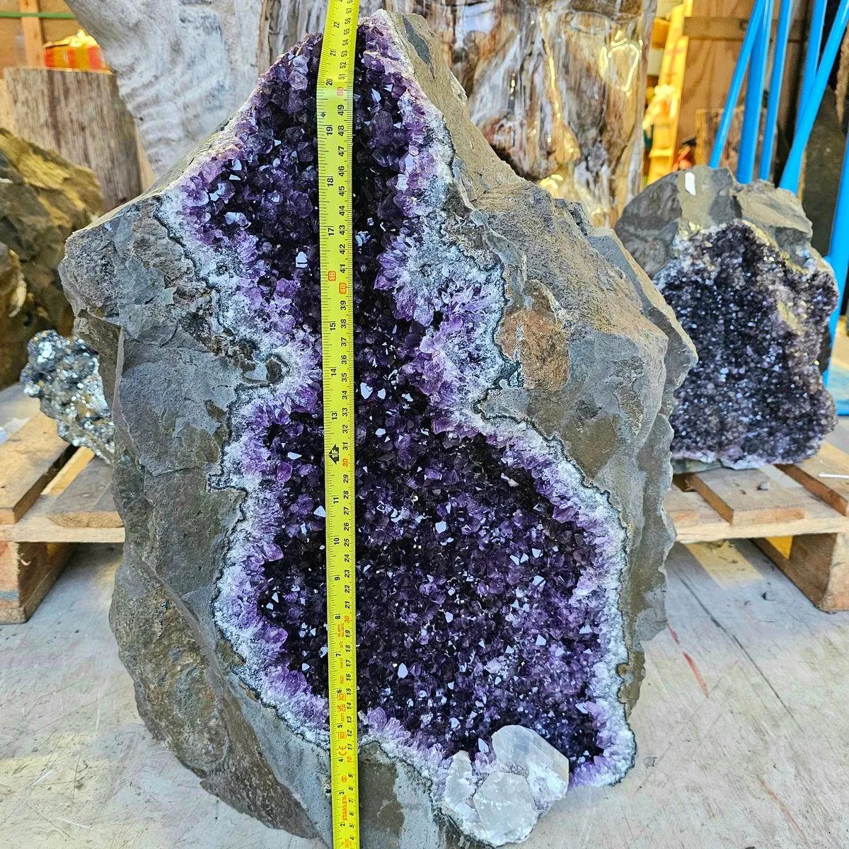 Front view of a 60kg Uruguayan amethyst cluster with deep purple colouring
