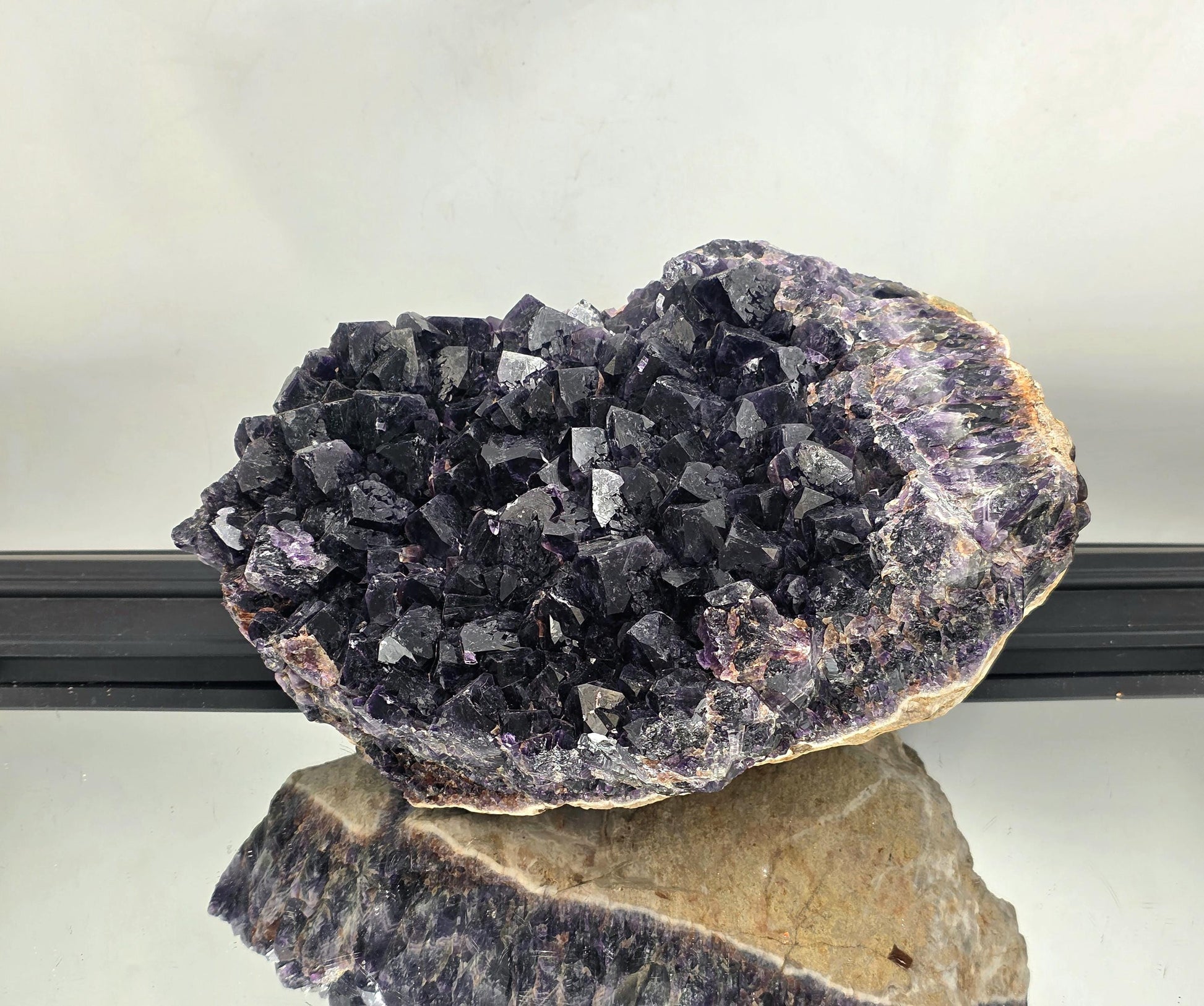 Large Zambian amethyst crystal cluster featuring rich violet hues.